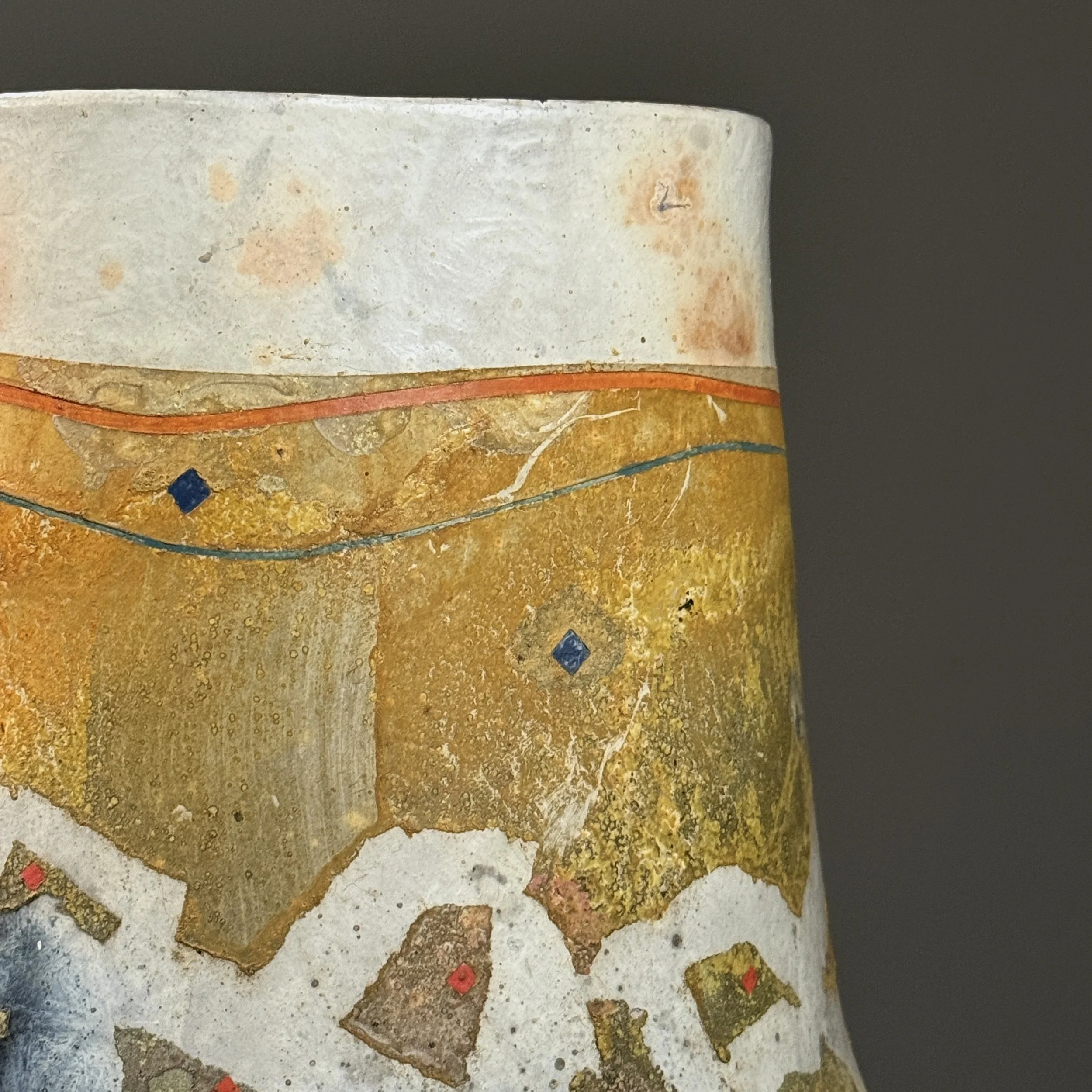 Glaze and surface detail. Pit-firing markings.