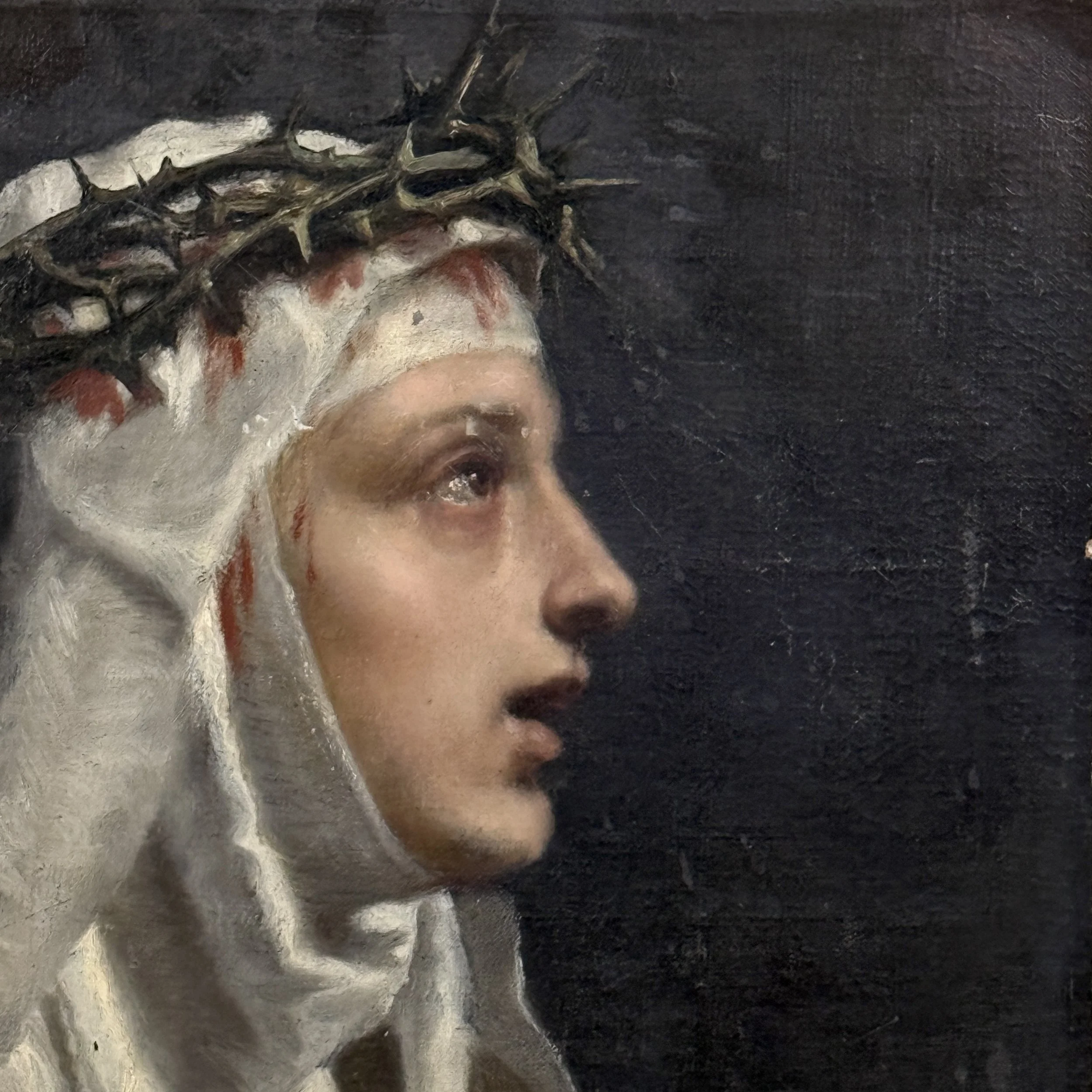 Close-up detail of Saint Catherine of Siena's face and crown of thorns in antique Academic Realist portrait, oil on board