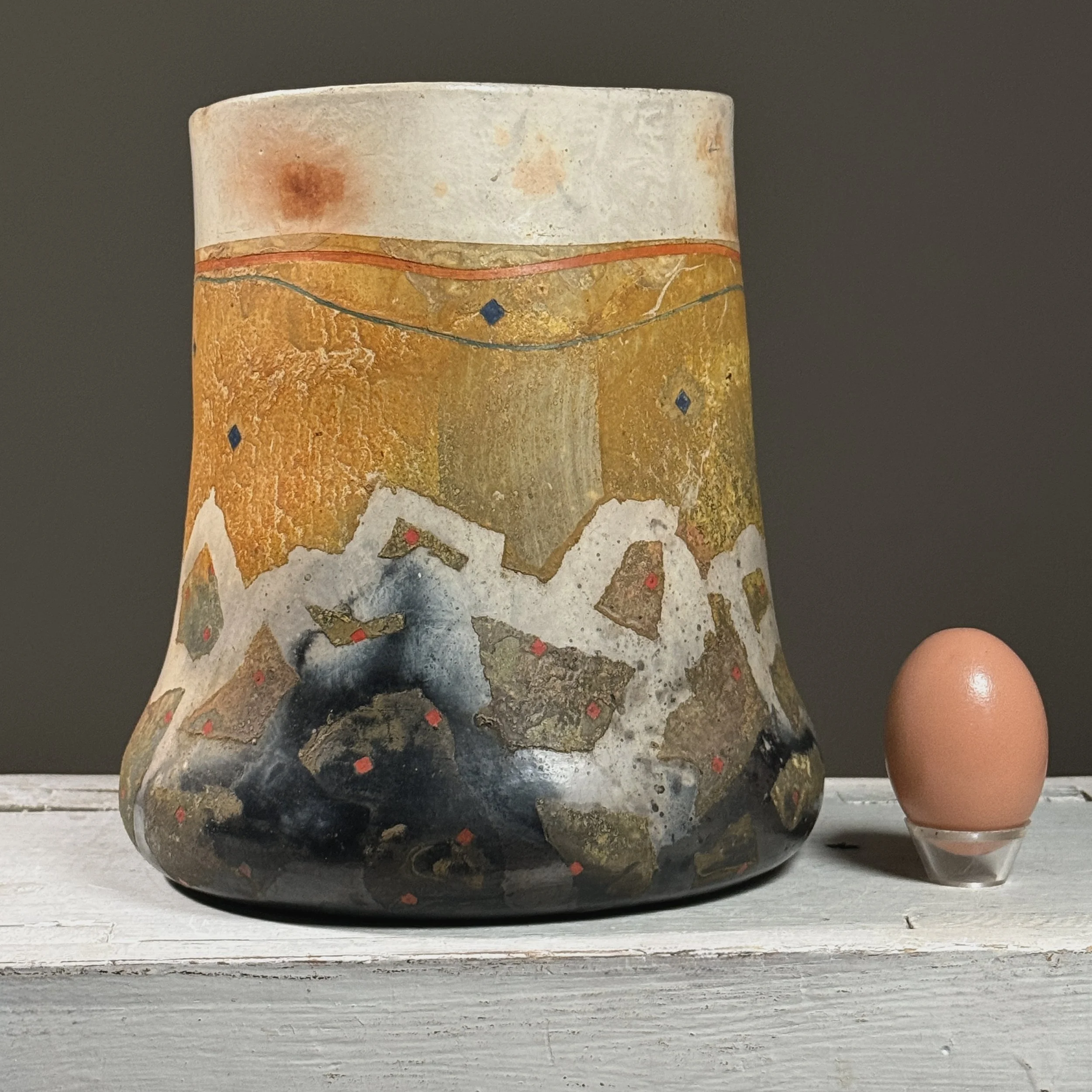 Front view with an egg for size reference.