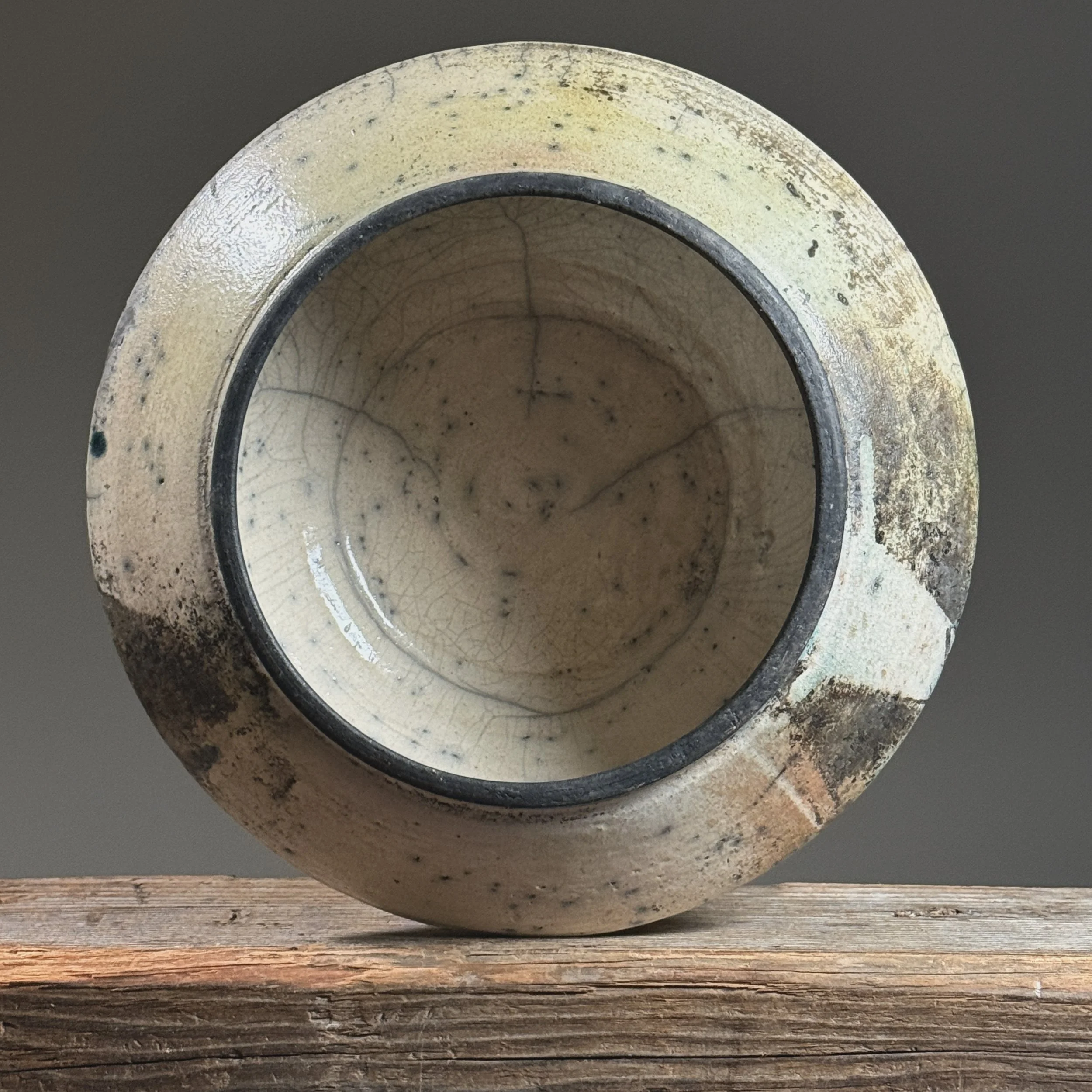 Top view of vessel. Crackle glaze throughout. Circular form.