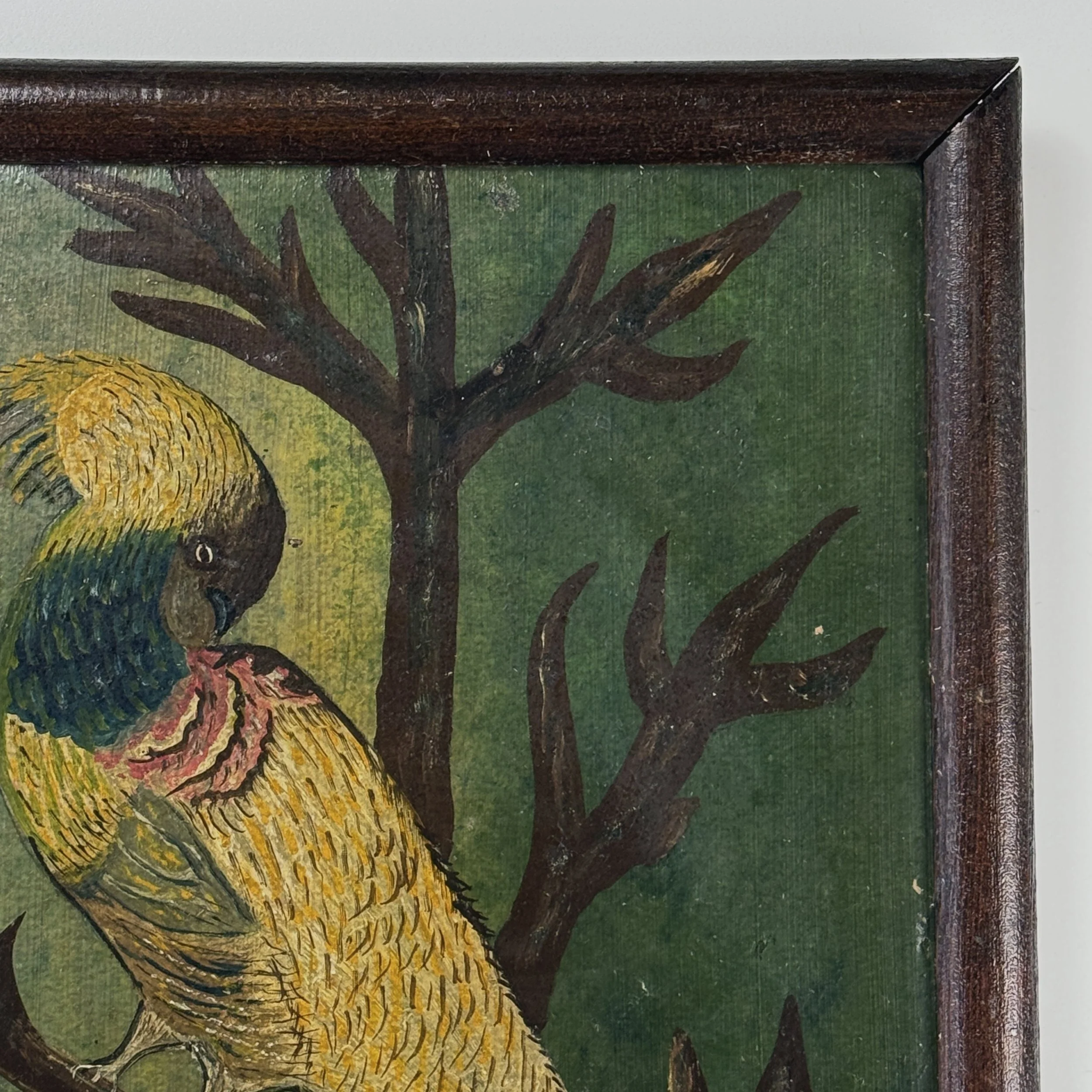 Close-up of original brown wooden frame surrounding the painting