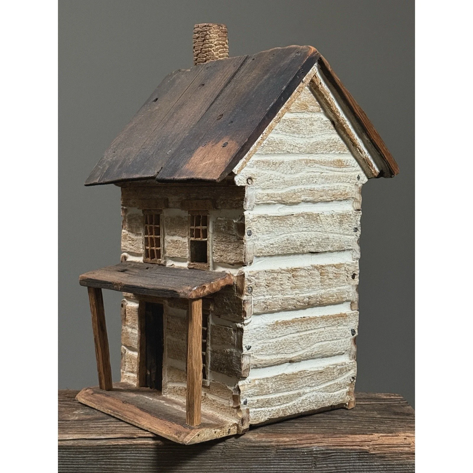 Rustic handmade vintage folk art house with chimney, hollow inside for lighting.