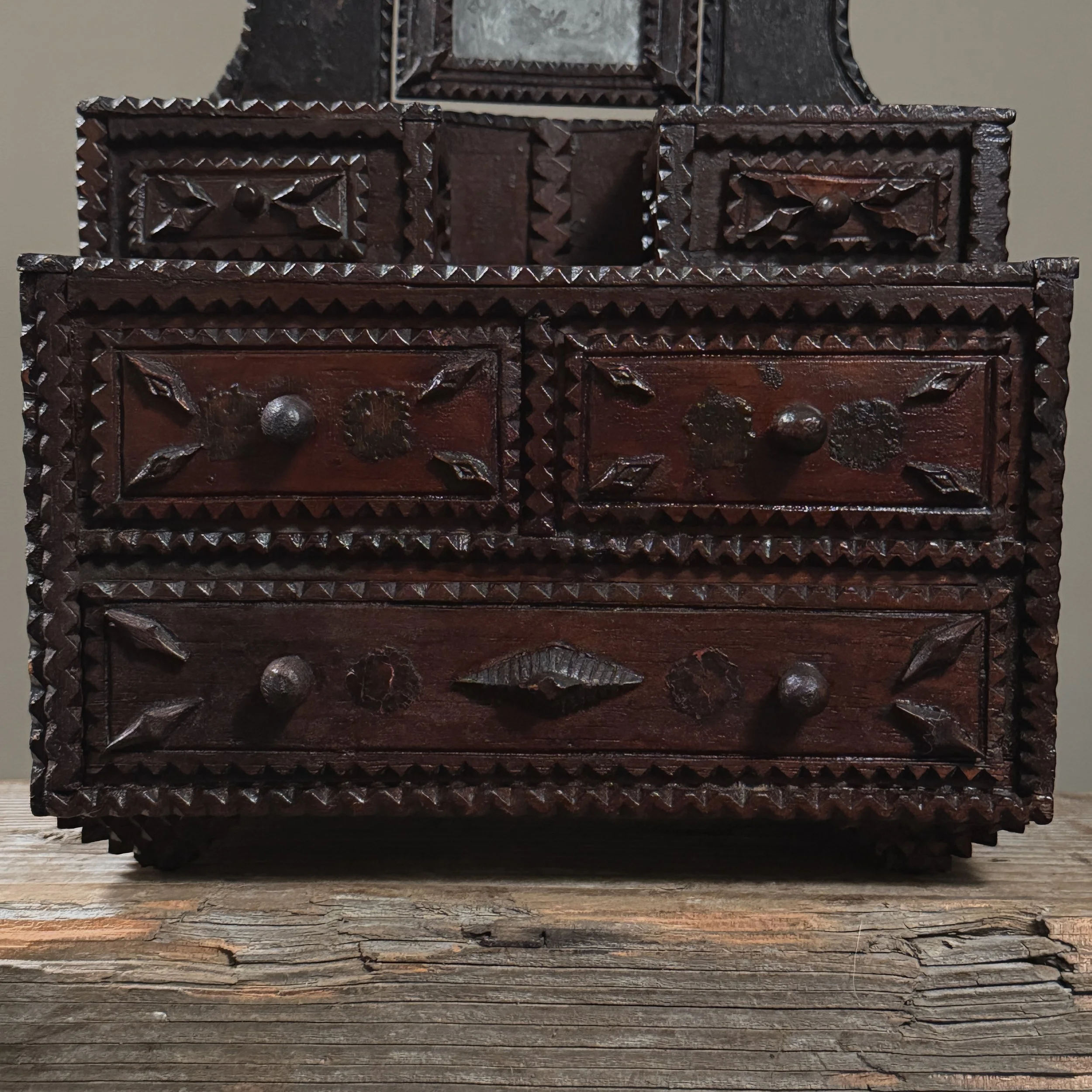 Close-up of applied wooden ornament on dresser front panel
