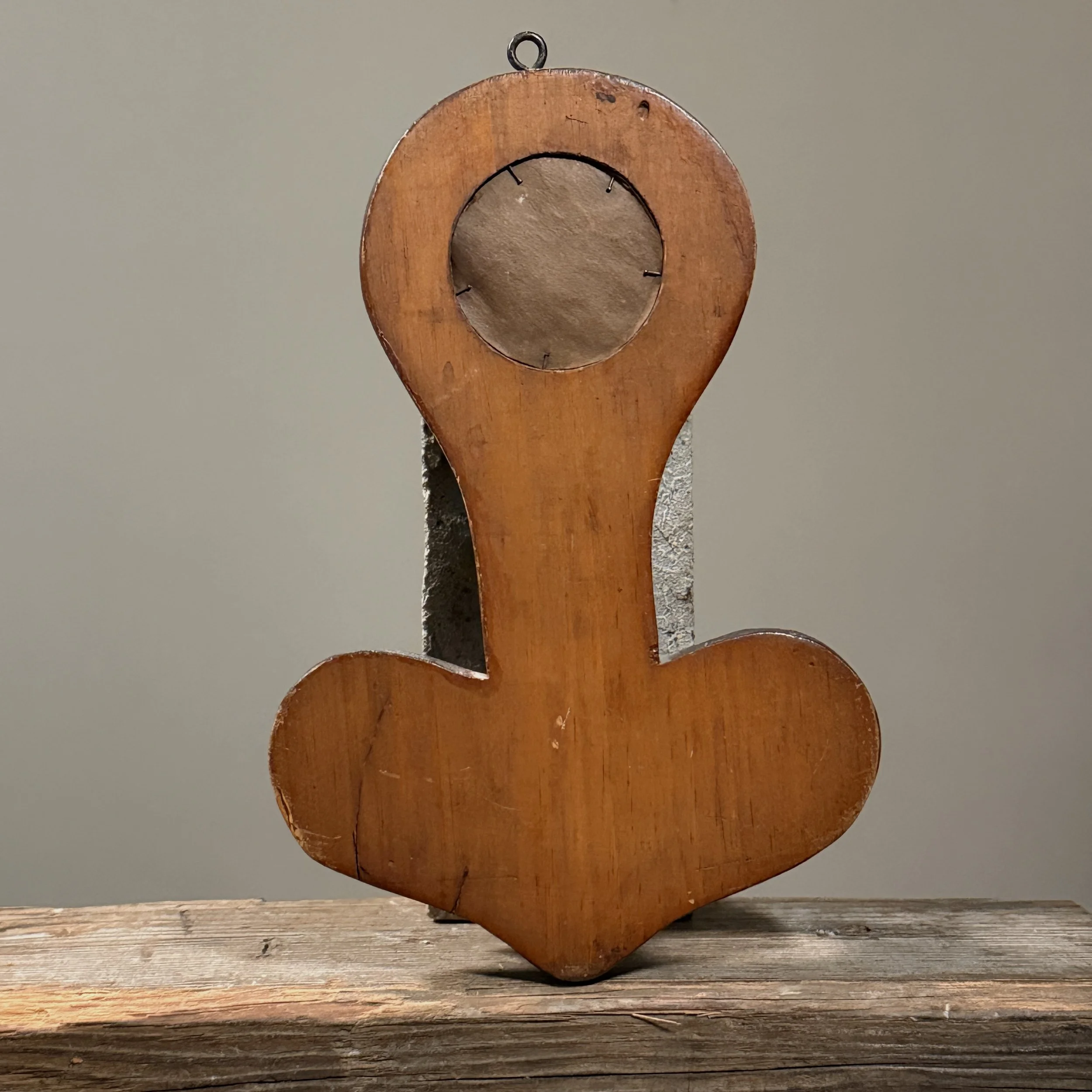 Bottom oval pocket on carved Tramp Art wall piece