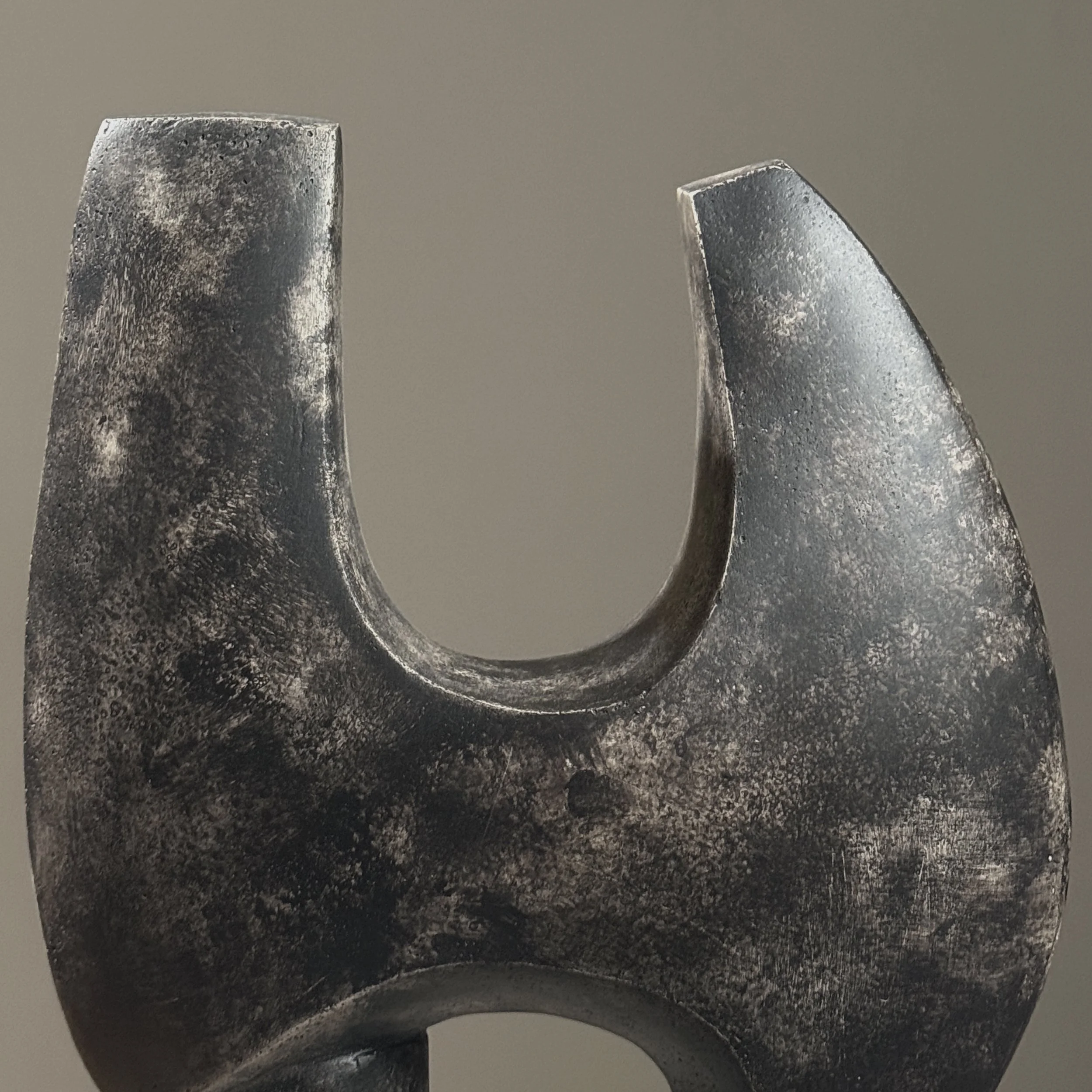 Macro detail of the cement surface texture and subtle tonal variations in the patina