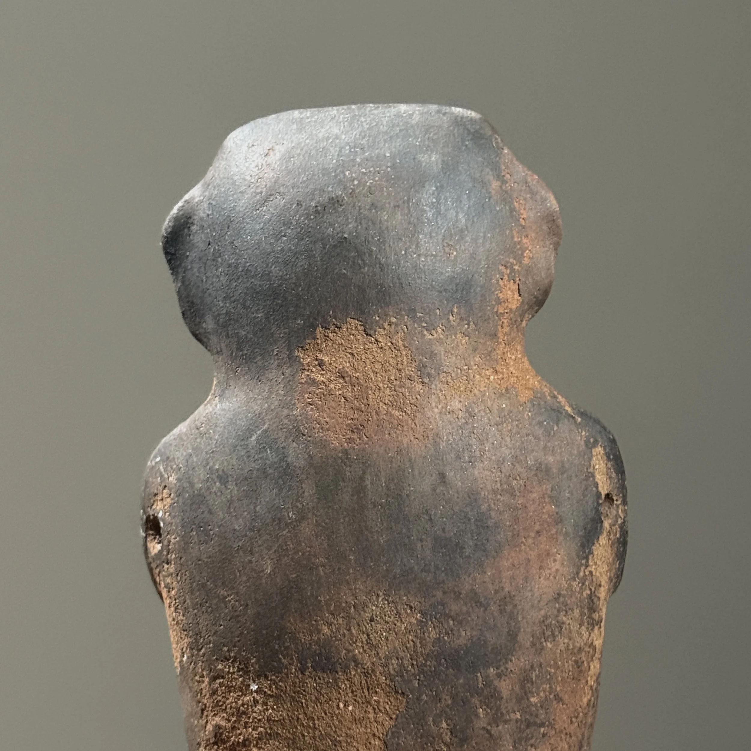 Back view of rattle. Figurative form. Wood fired clay surface.