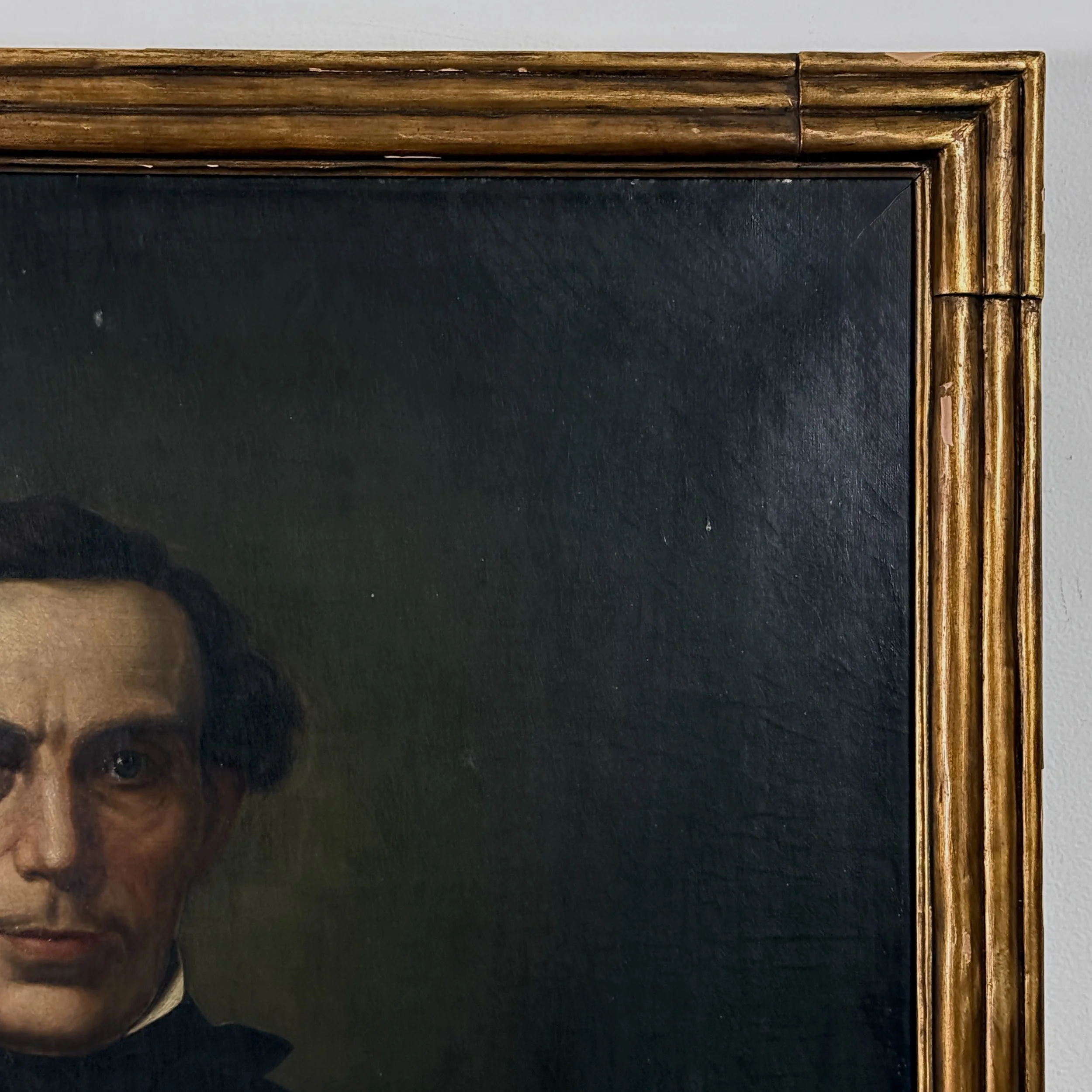 Detail of gesso and composition loss along the frame's outer edge.