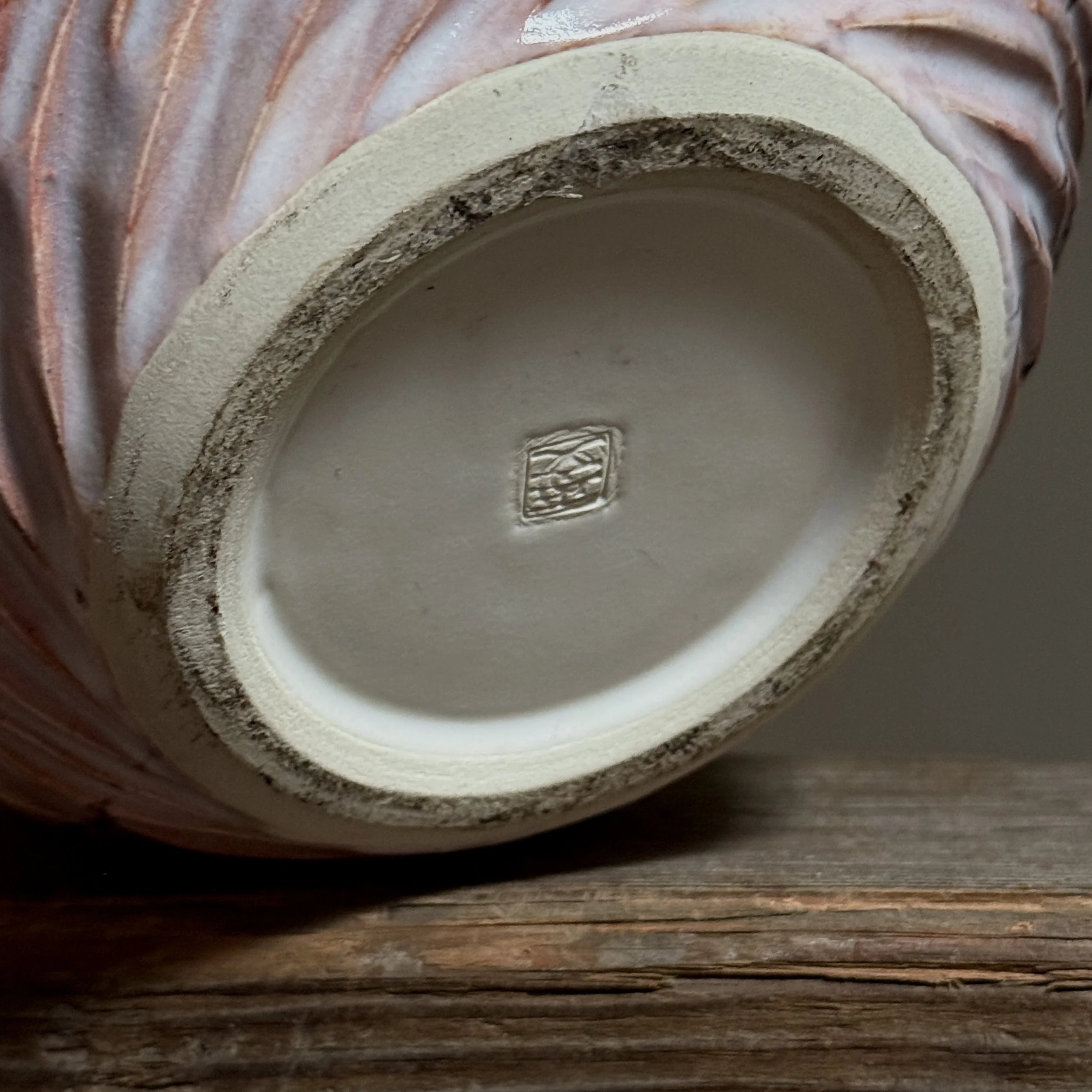 Base of Japanese ceramic vase showing artist stamp and signature