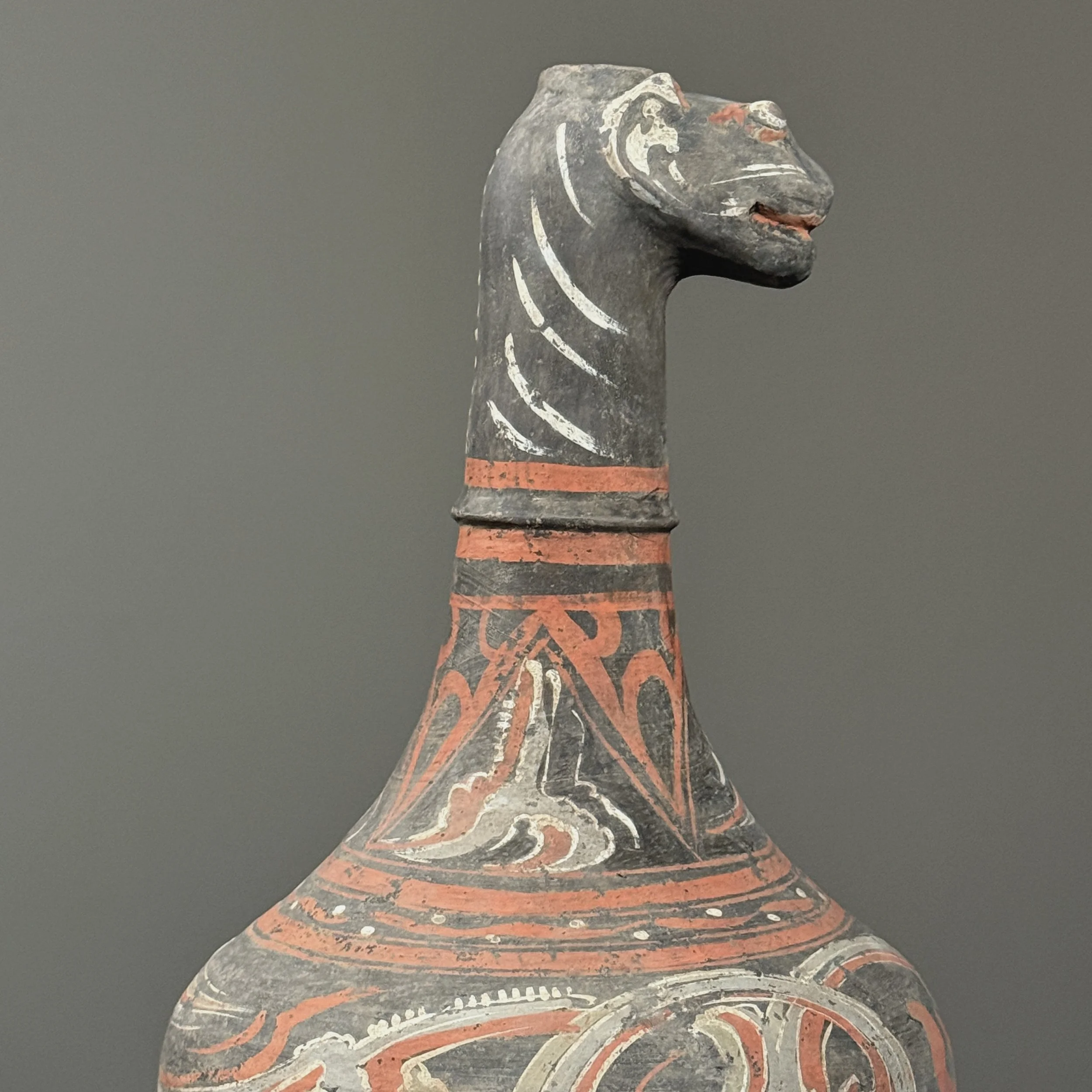 Close up of animal shaped spout on Chinese ceramic vessel