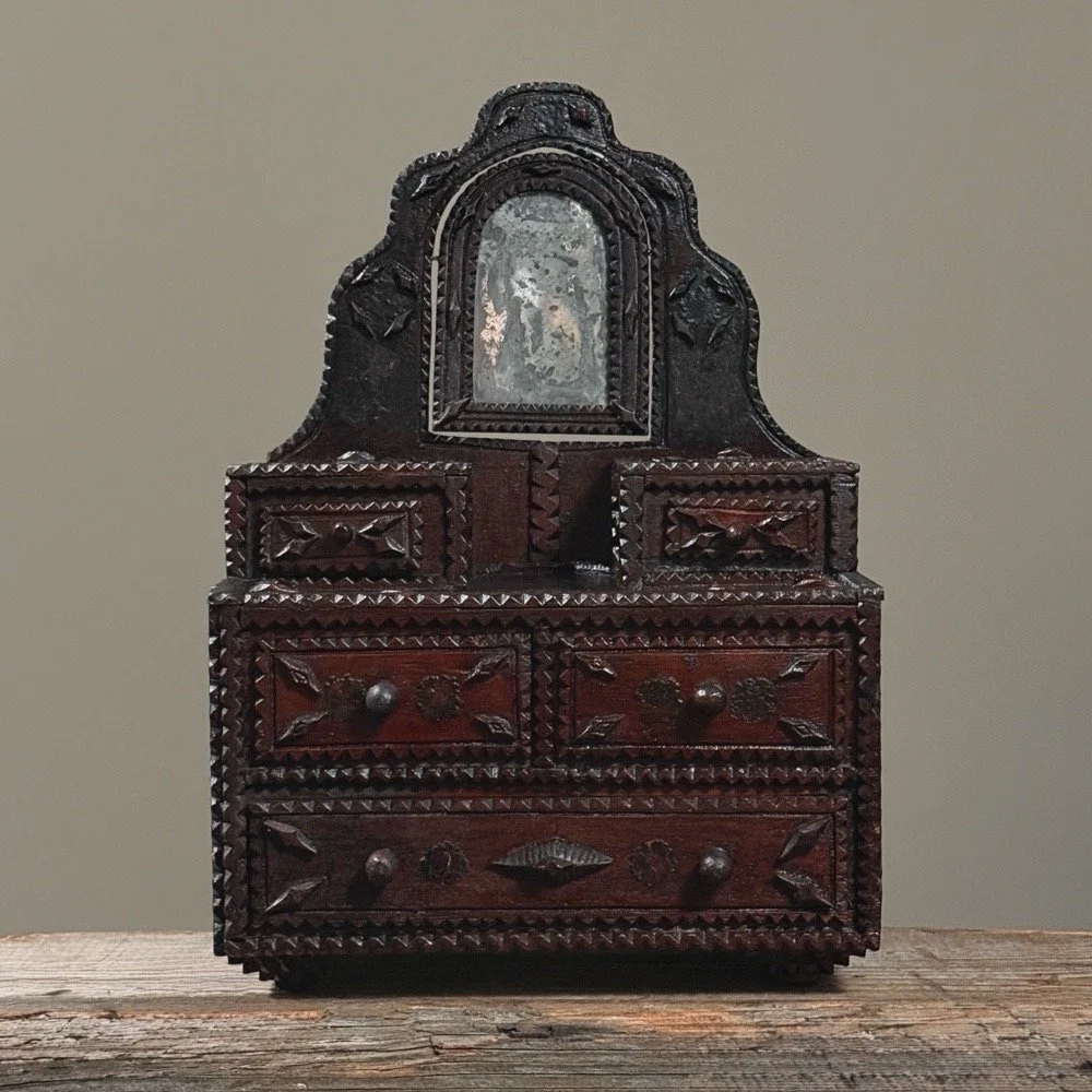 Full view of antique tramp art tabletop dresser with chip carving, mirror, and drawers