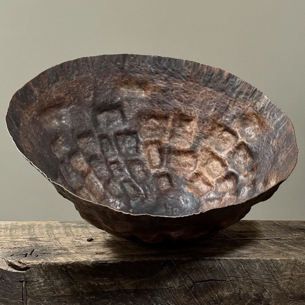 Anthony Di Bona large Brutalist hammered copper bowl on a neutral table.