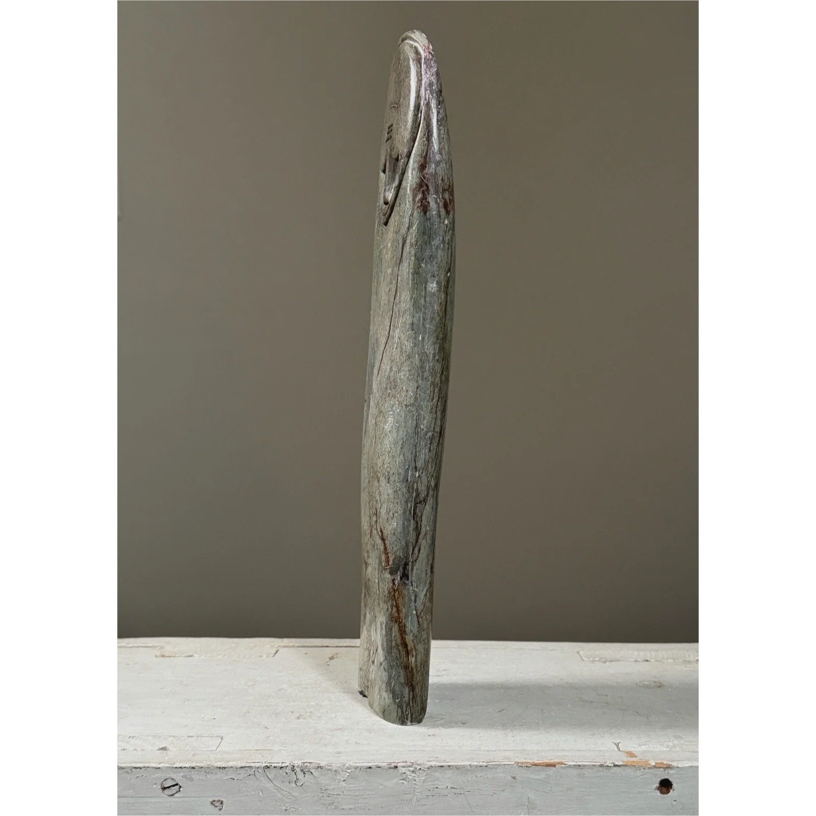 Side angle of abstract serpentine stone figure