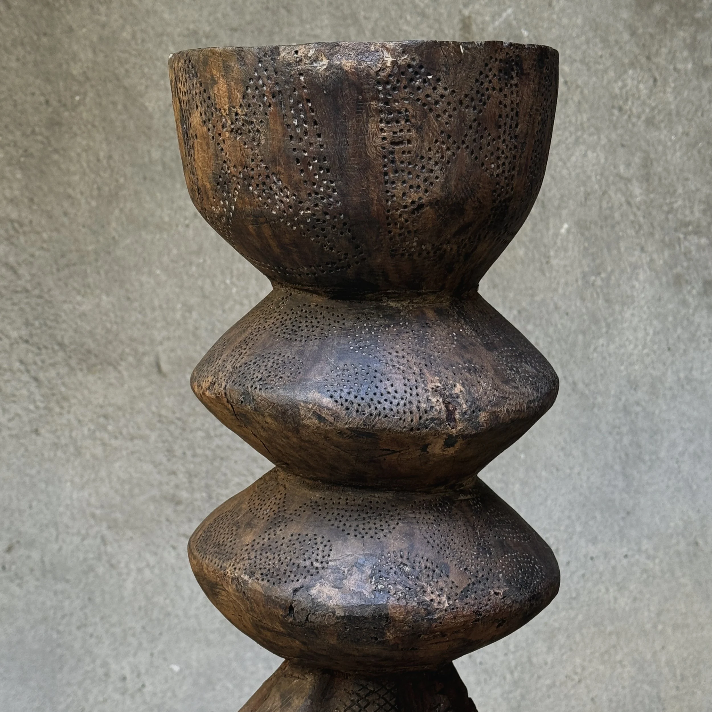 Stippled surface detail on carved wood top