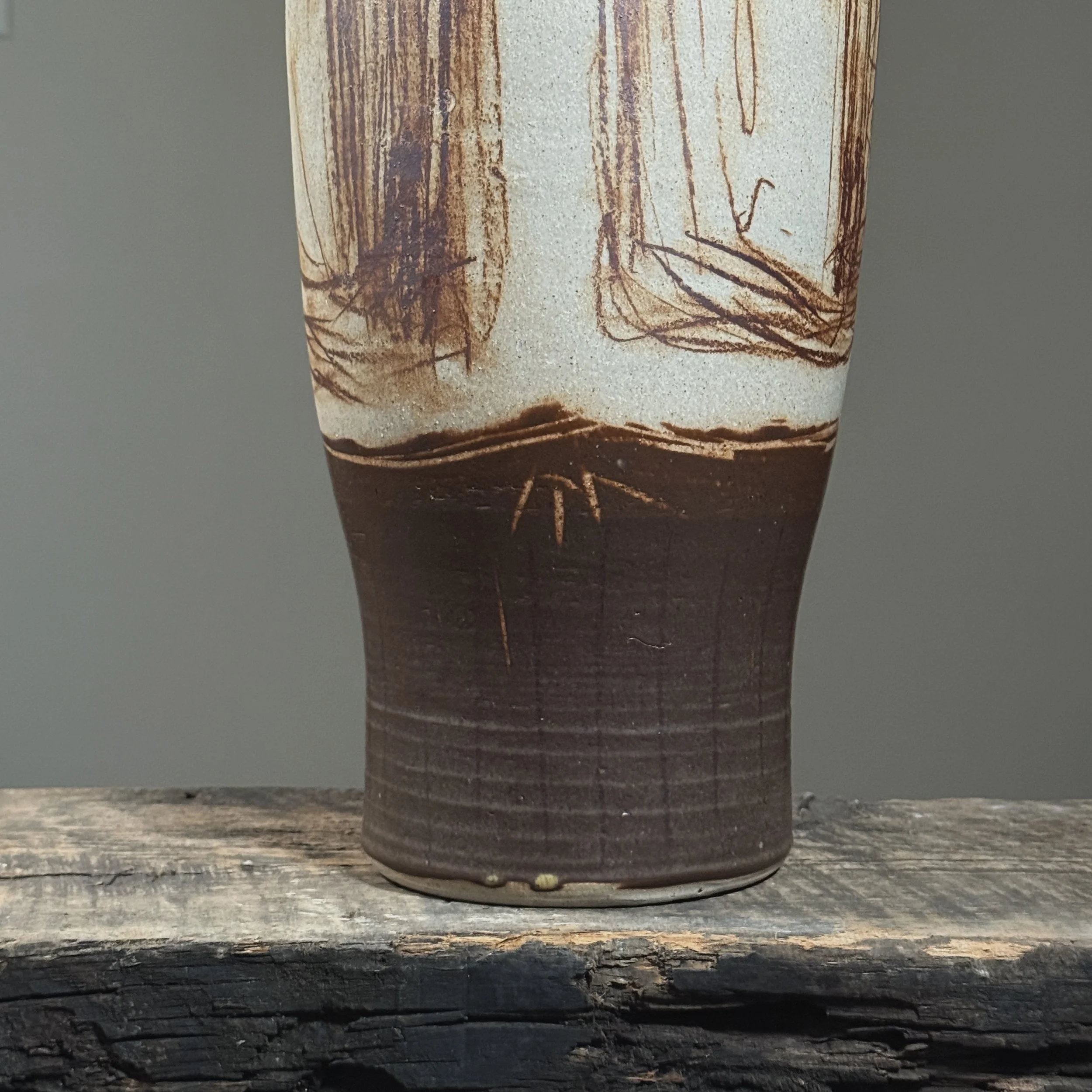 Brown-glazed narrow base on tall art pottery vessel