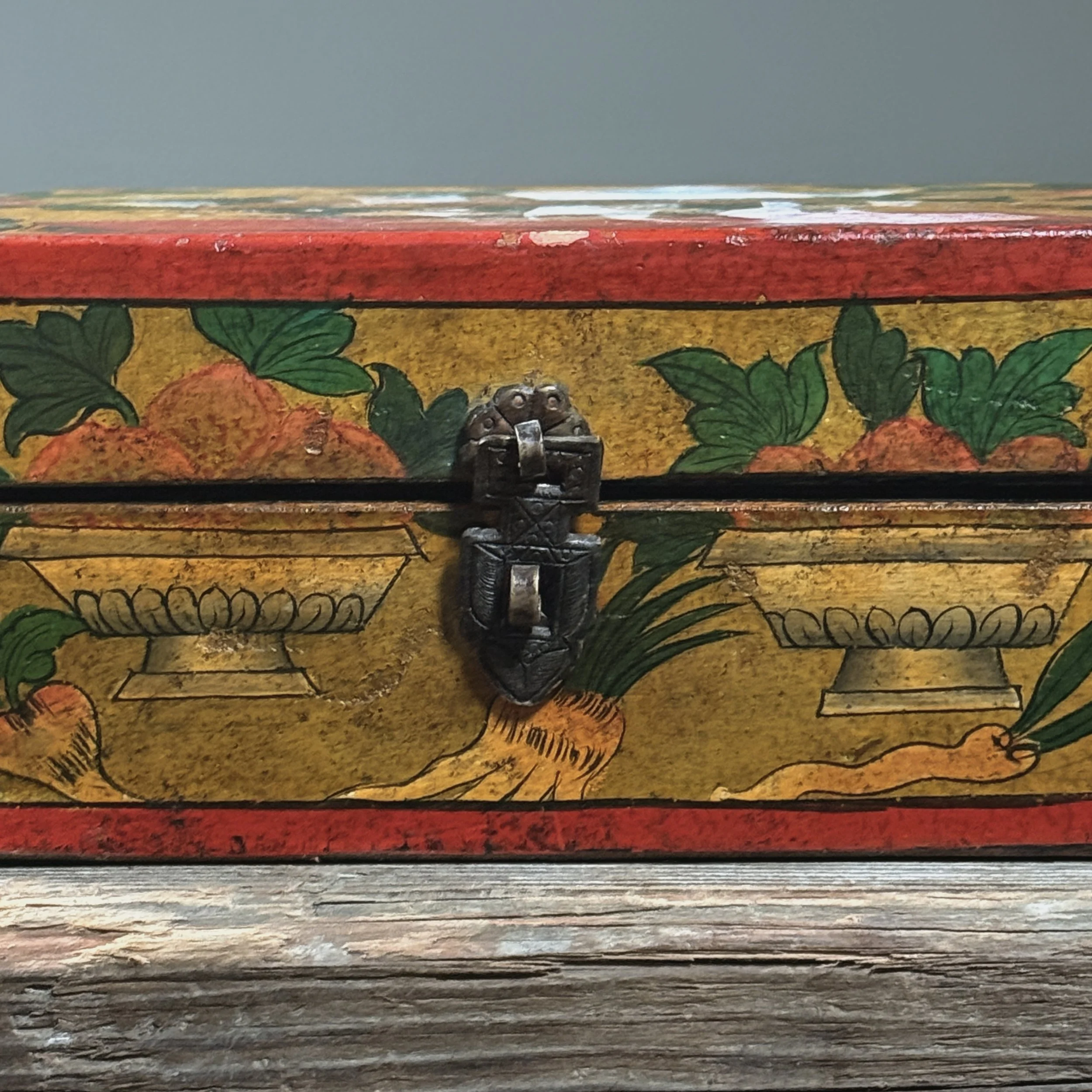 Close-up of exterior decoration. Fruit and foliage motif. Hand painted brushwork.