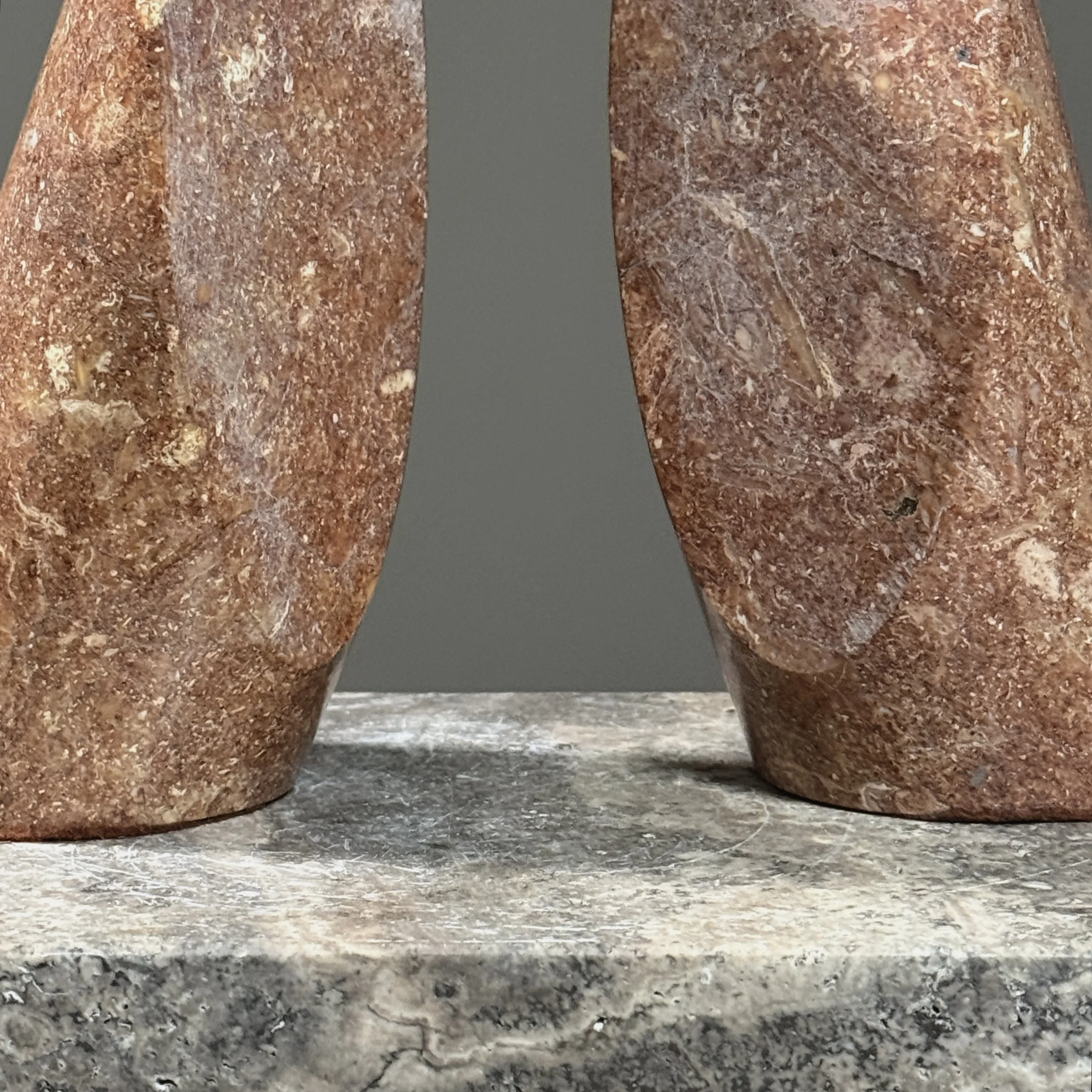 Bookend surface detail. Rosy brown stone. Natural veining.