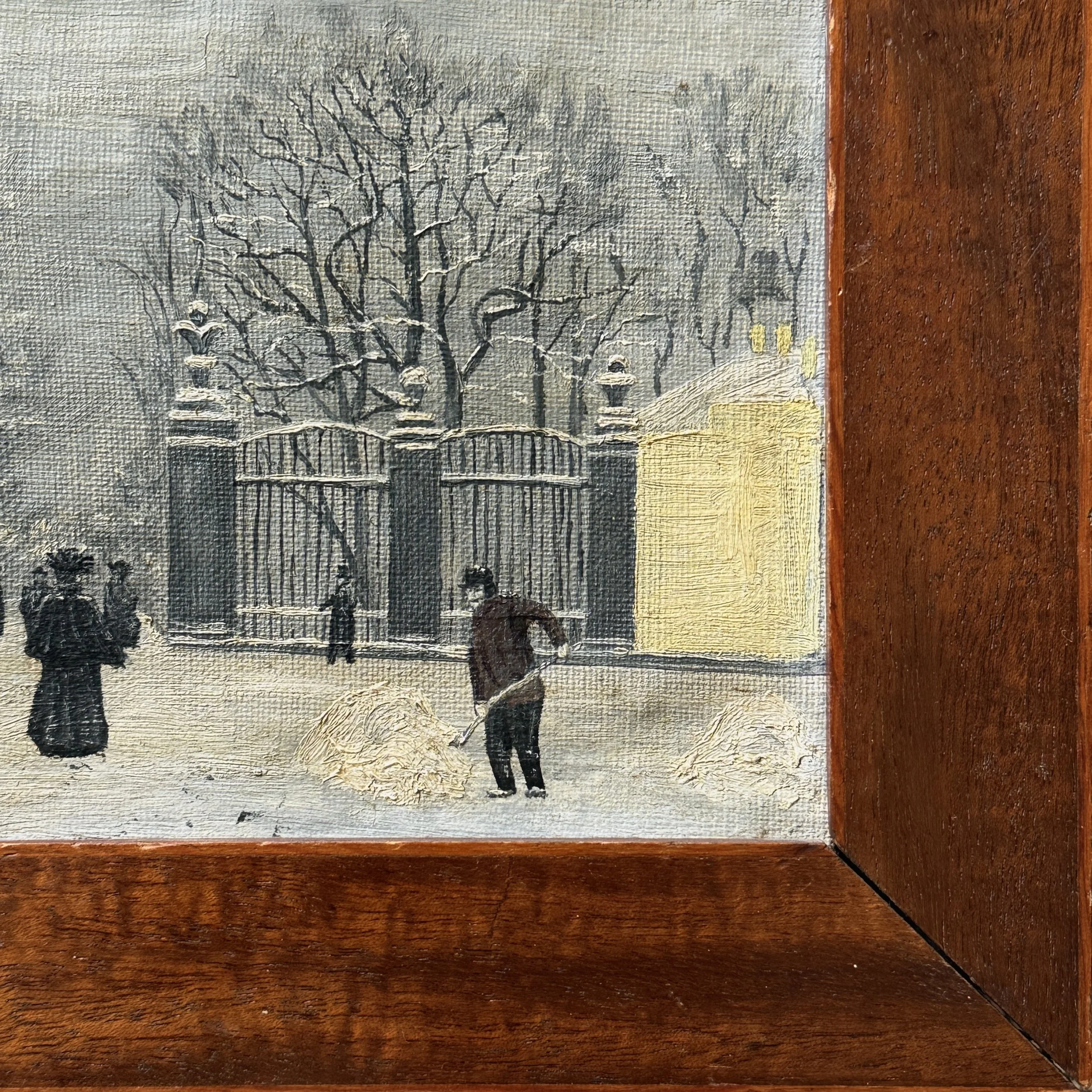 Snow-shoveling figure in foreground, park entrance view
