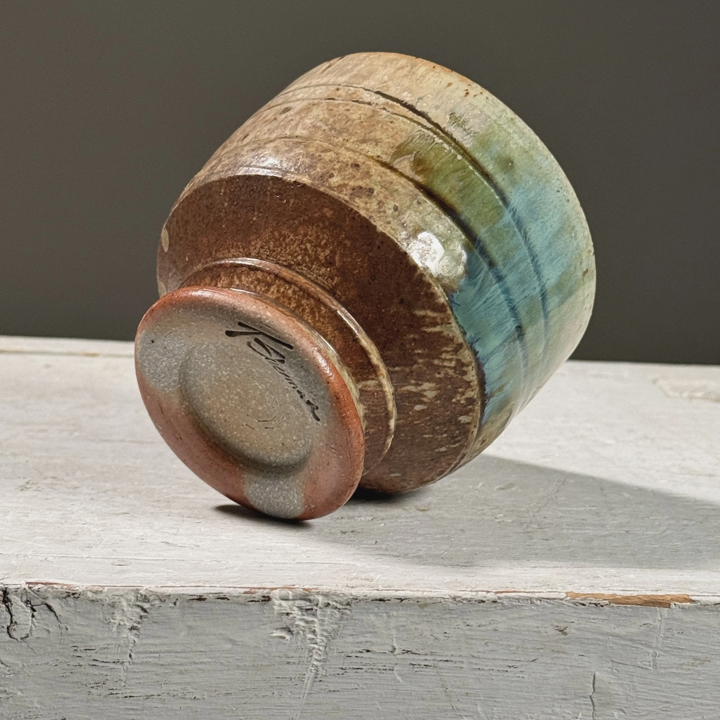 Detail of the artist's signature on the bottom.