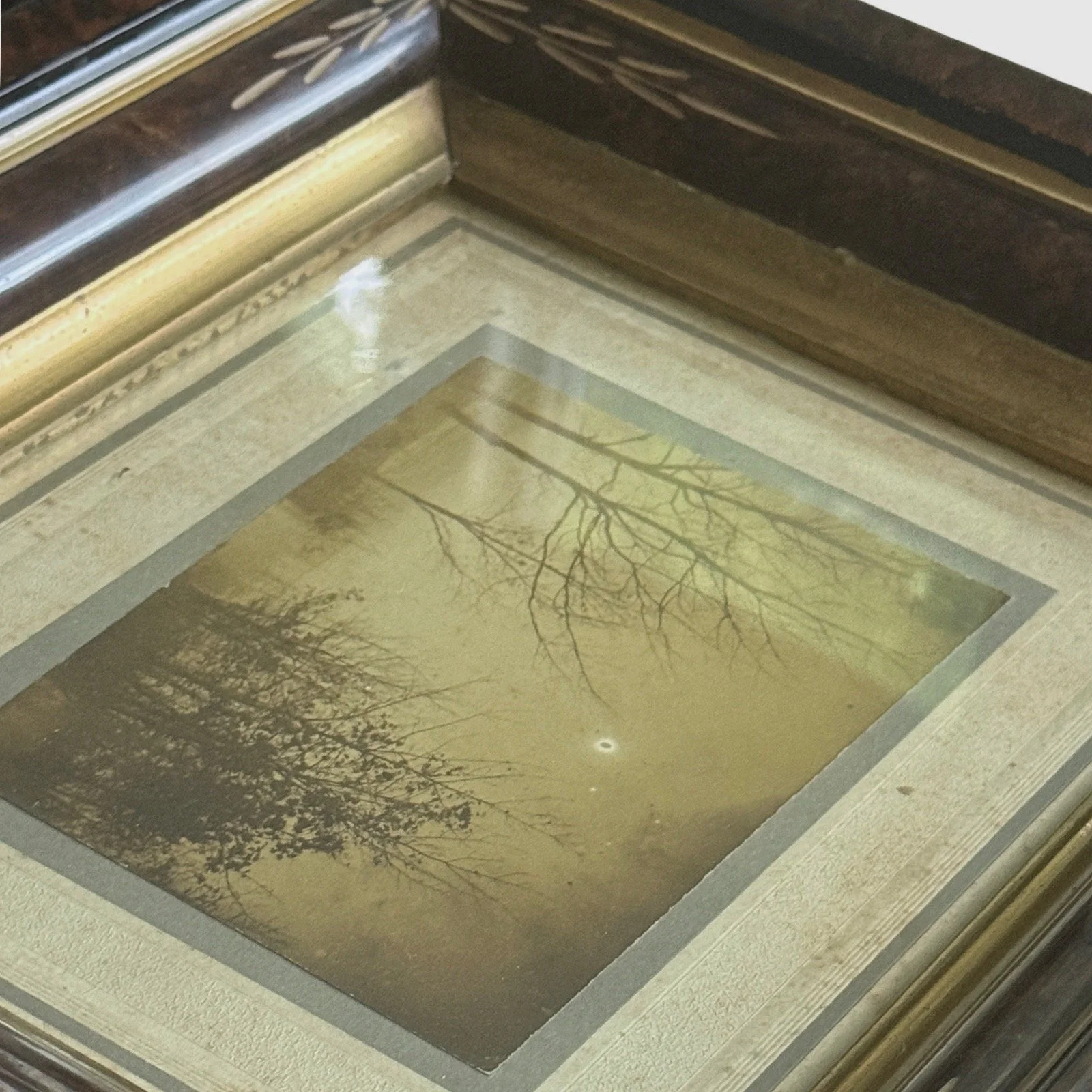 Frame edge detail. Wear consistent with age. Frame older than photograph.