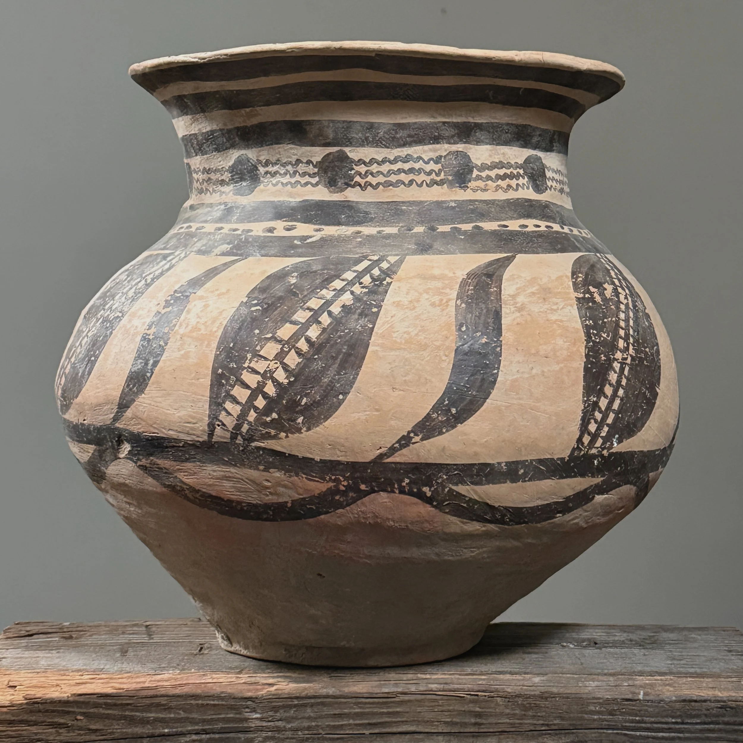Side view of the rounded, hand-built Neolithic-style vessel.