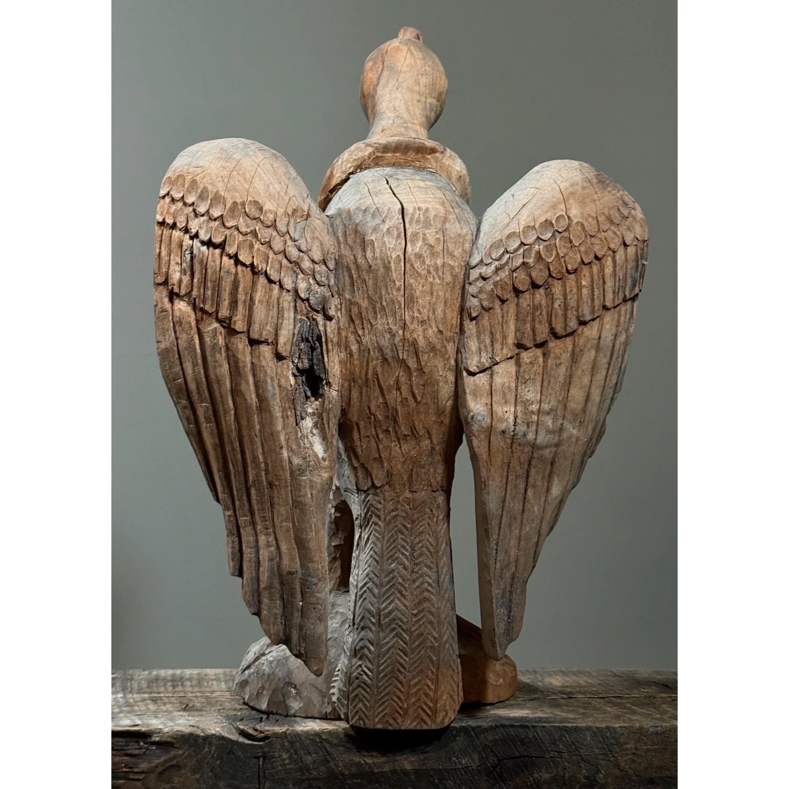 American folk art hand carved bird statue, back view