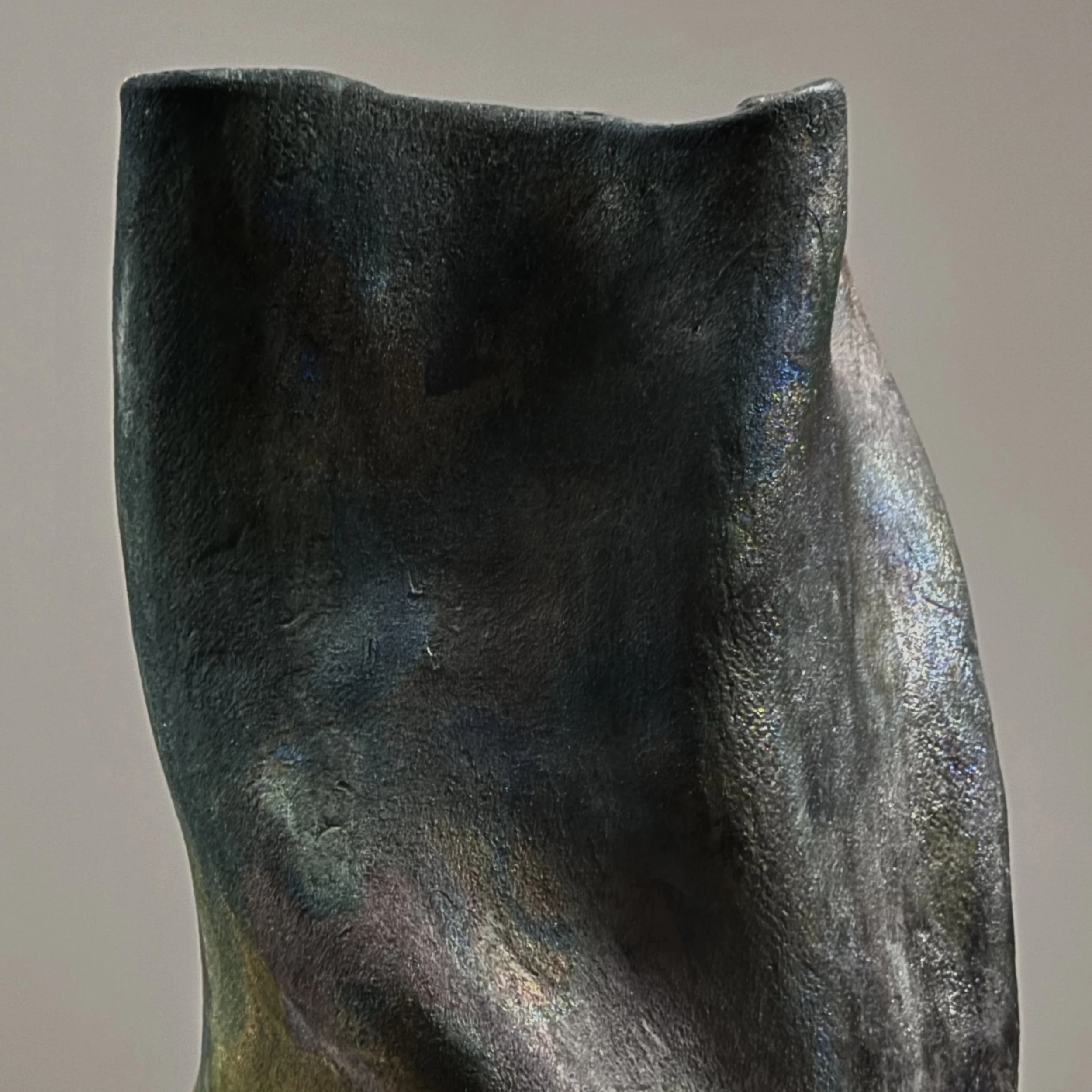 Metallic glaze detail, blackware vessel, red yellow blue accents