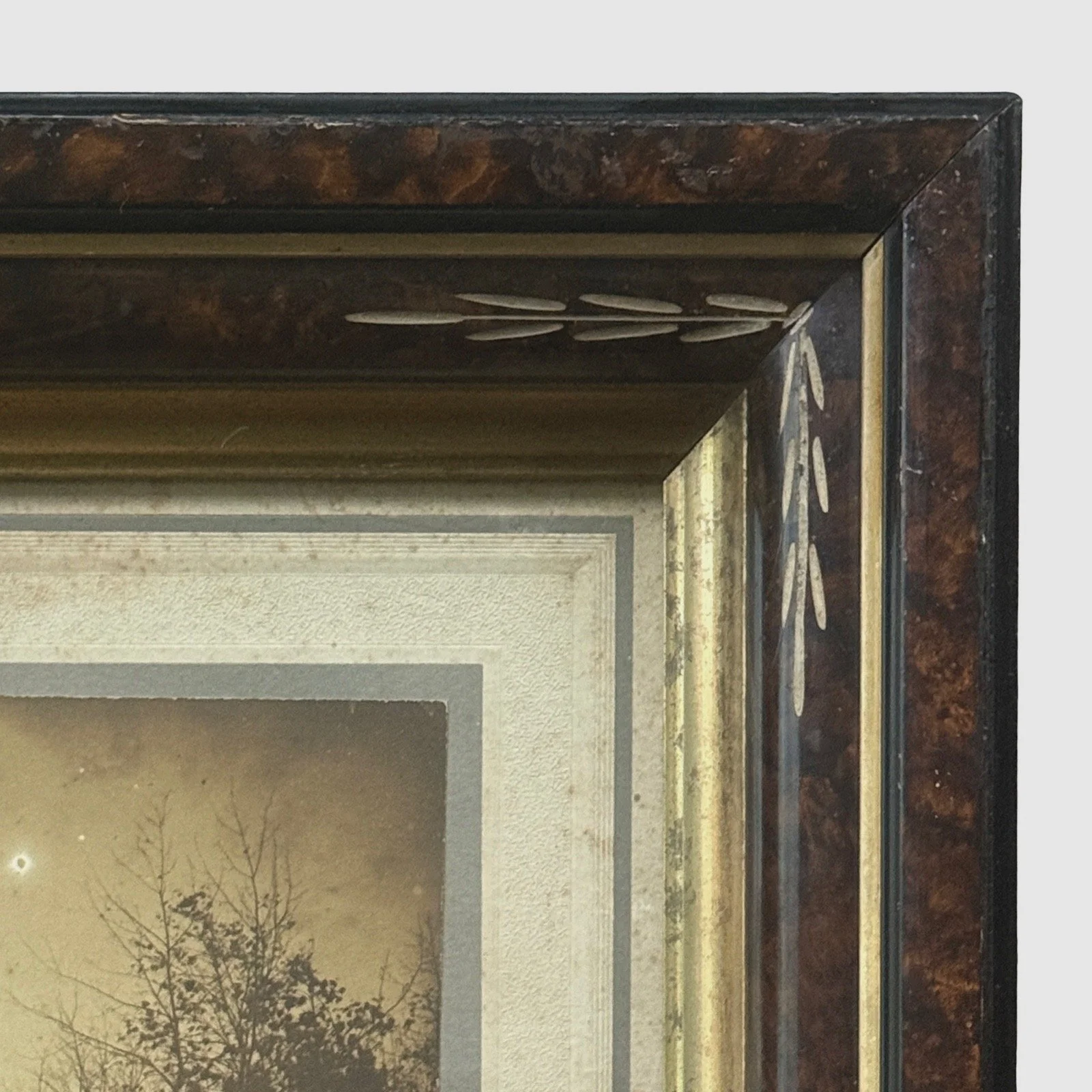 Victorian frame detail. Carved ornamentation. Faux marbling finish.