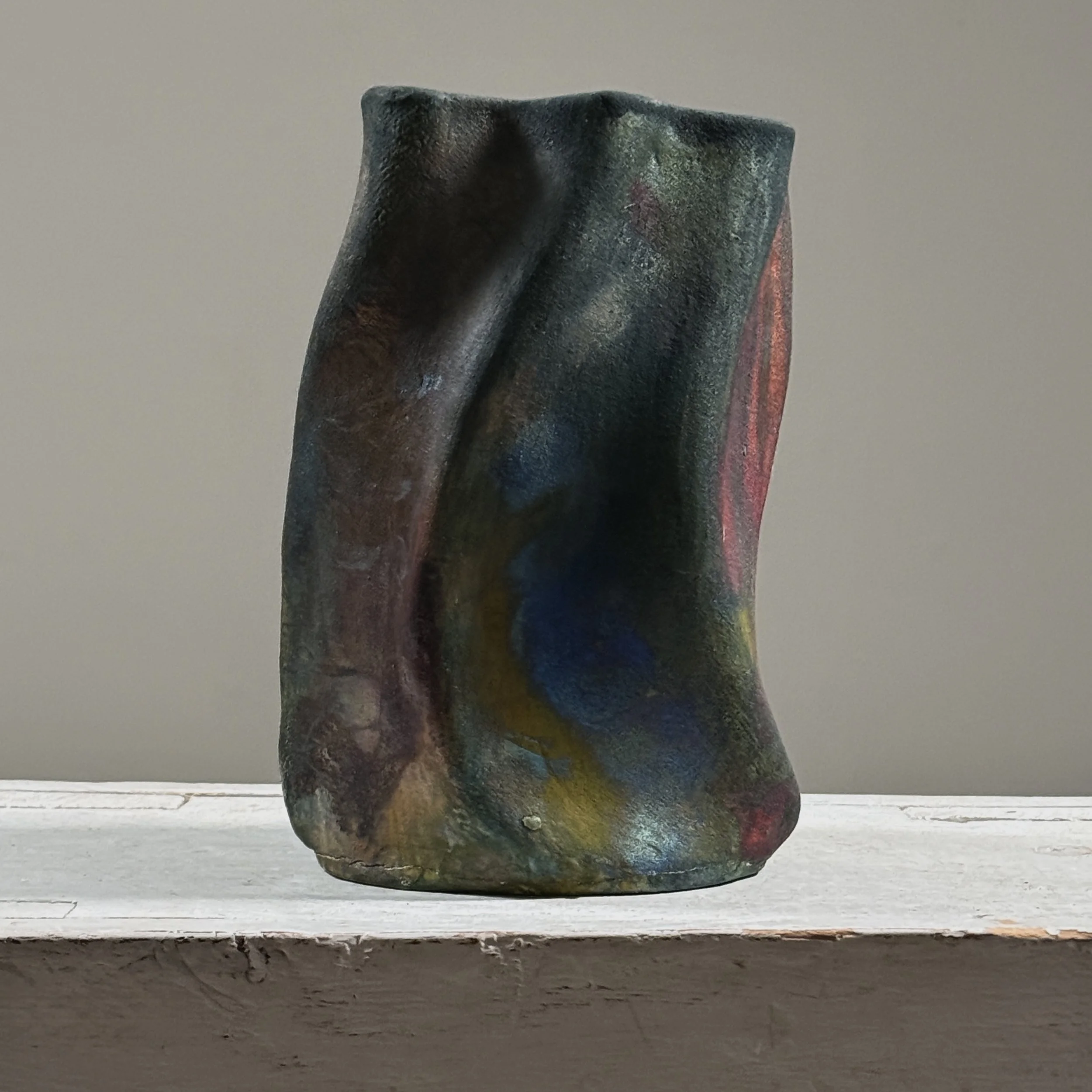 Vintage raku fired abstract fluid shaped blackware ceramic vessel, signed