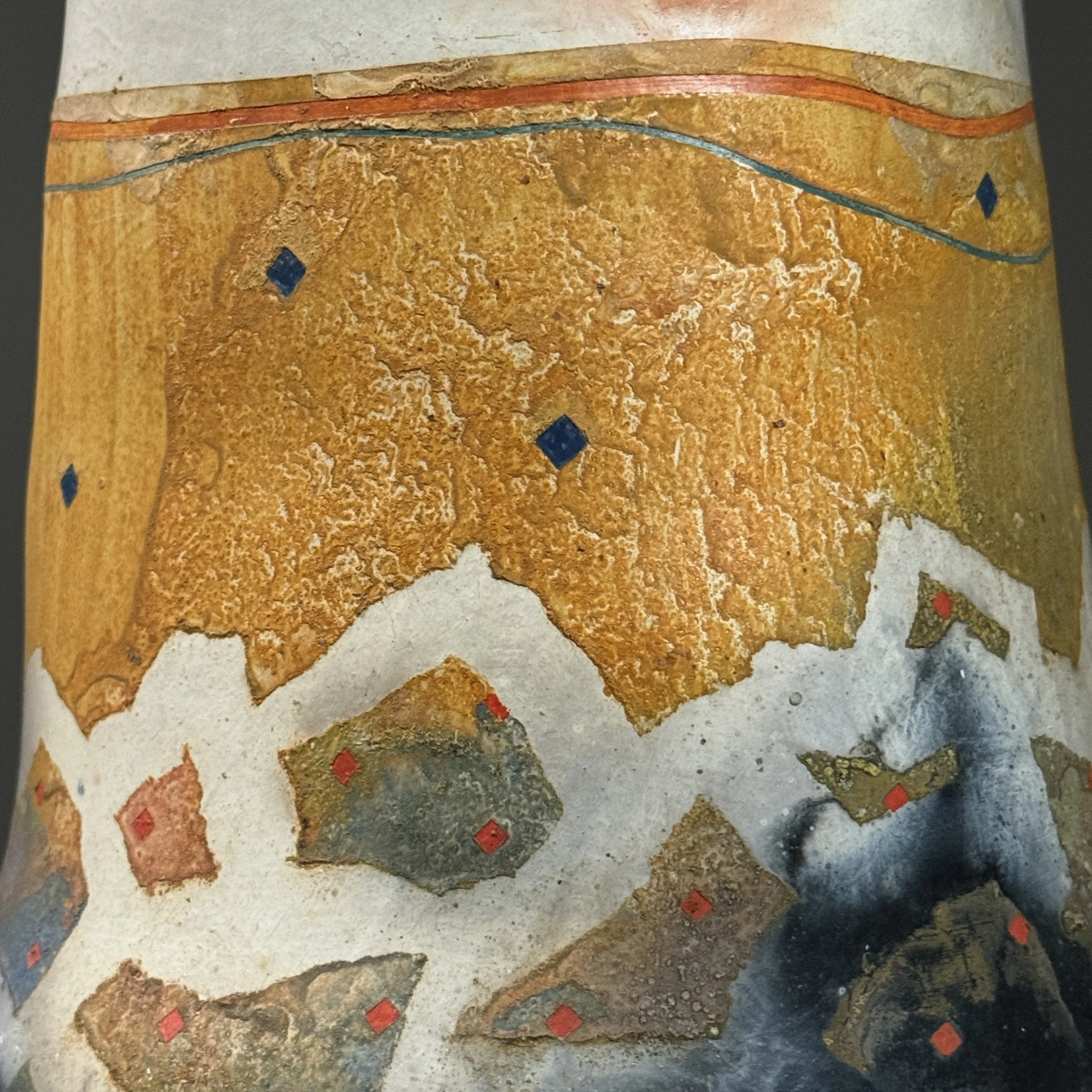Glaze and surface detail. Pit-firing markings.