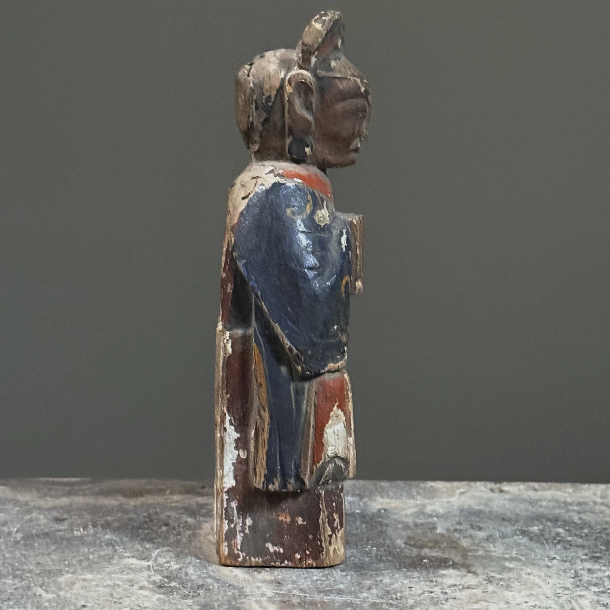 Side profile showing the figure's proportions and depth.