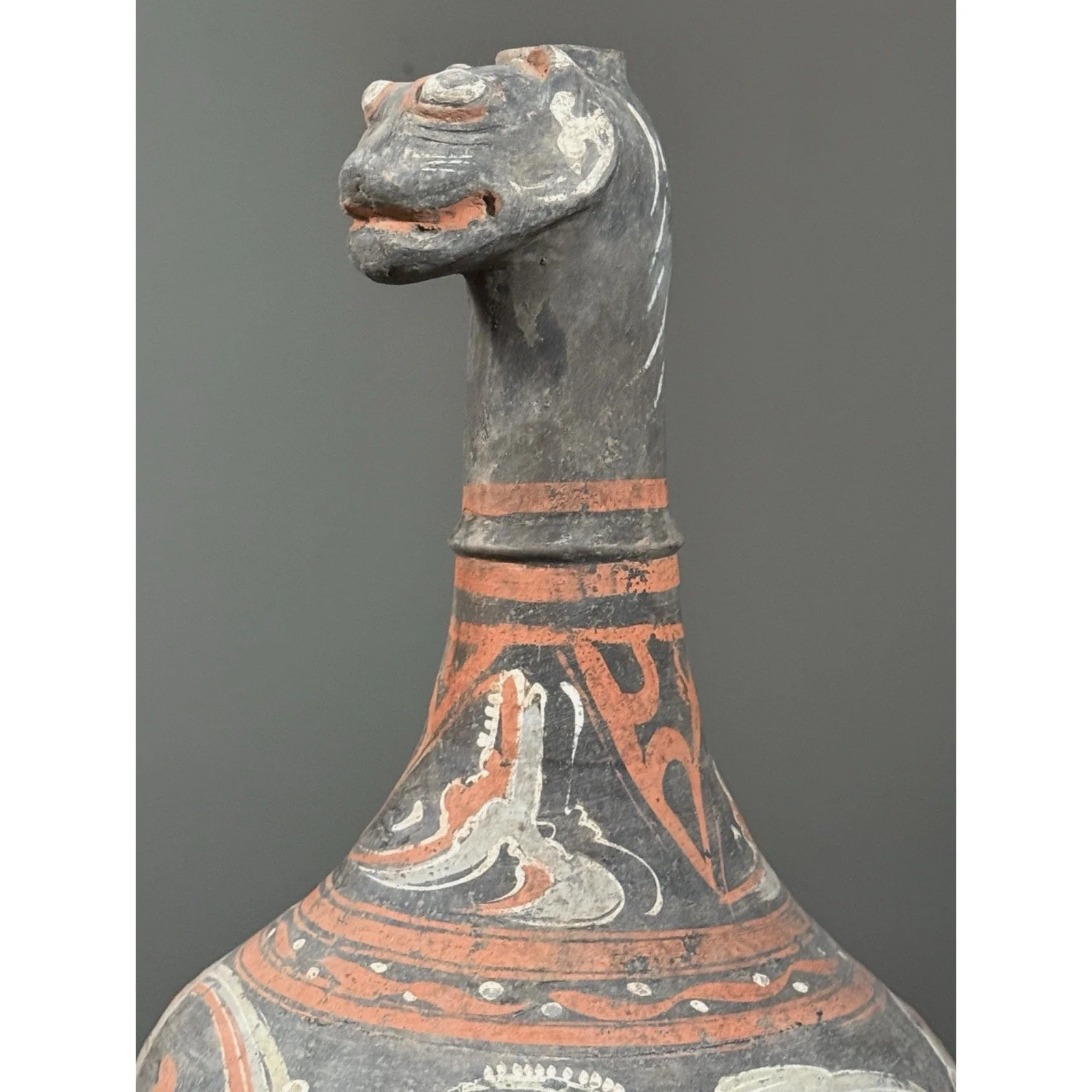 Close up of animal shaped spout on Chinese ceramic vessel