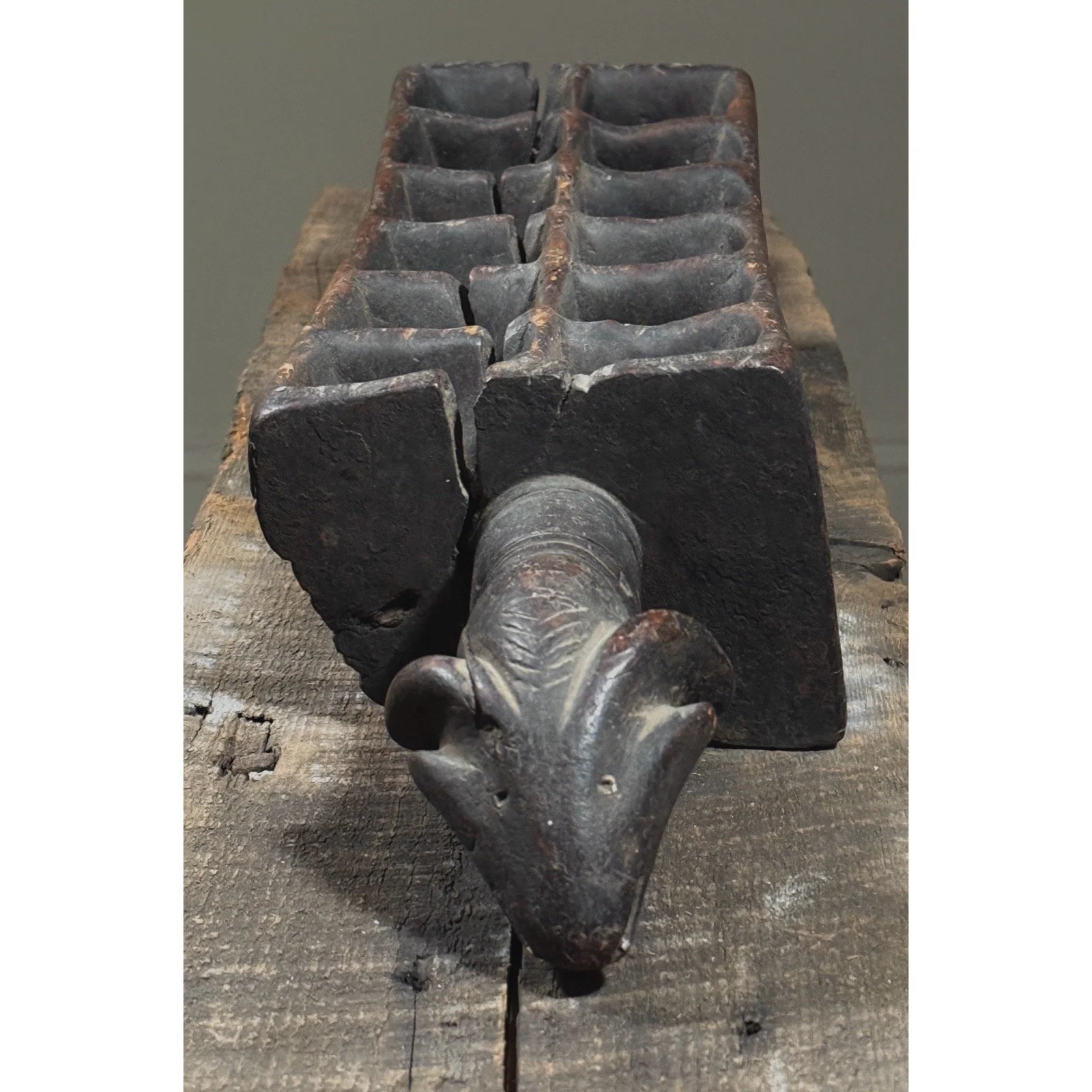 Carved African folk art object combining sculpture and game board design