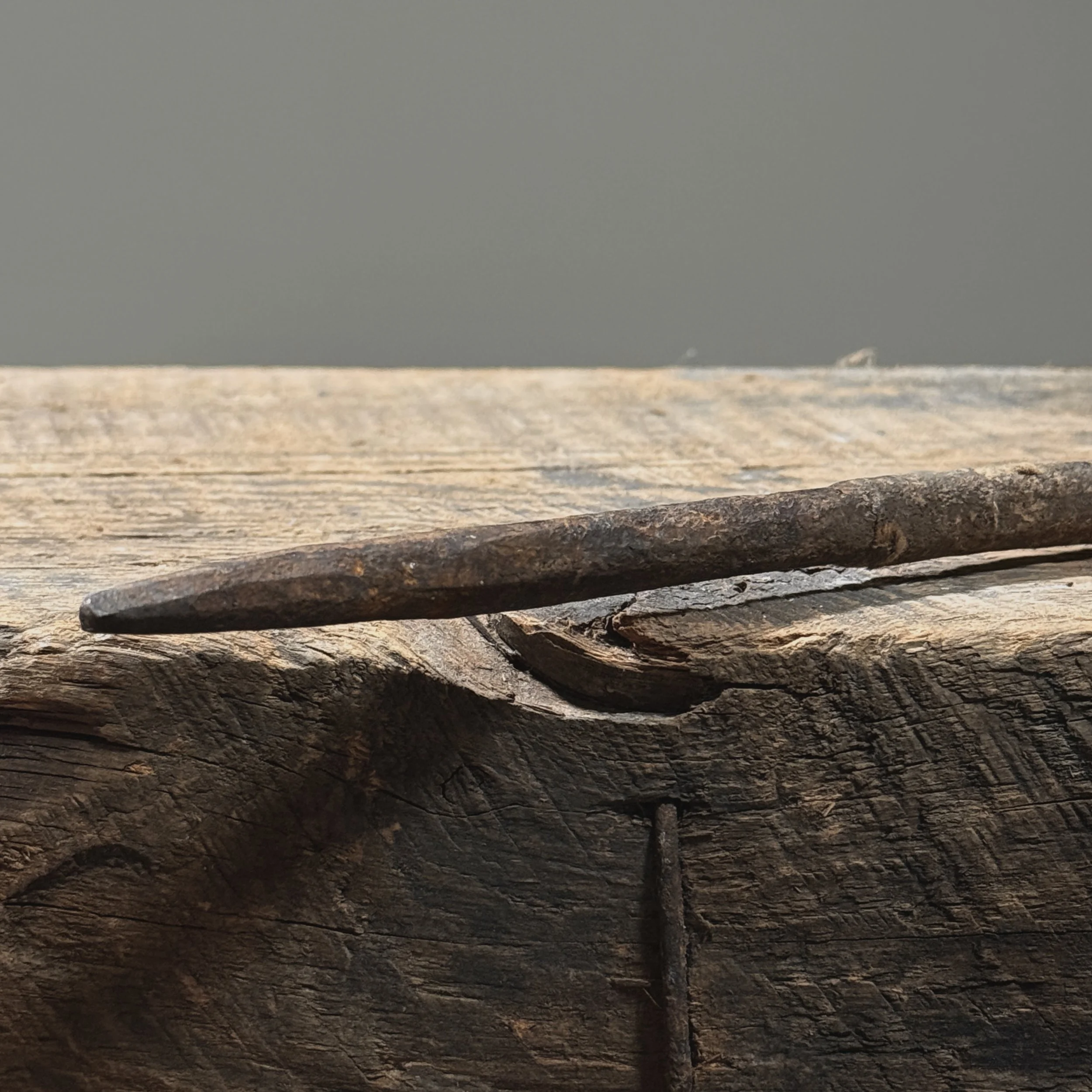 Detail of iron surface. Ochre-brown patina. Wrought texture.
