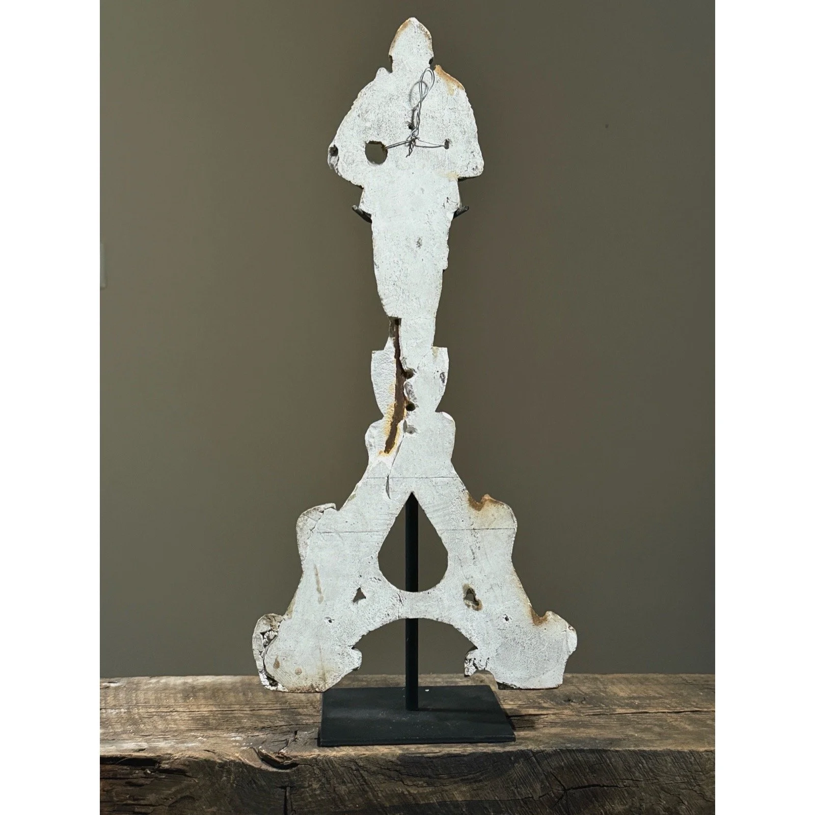 Verso view of plaster fragment with original iron reinforcement