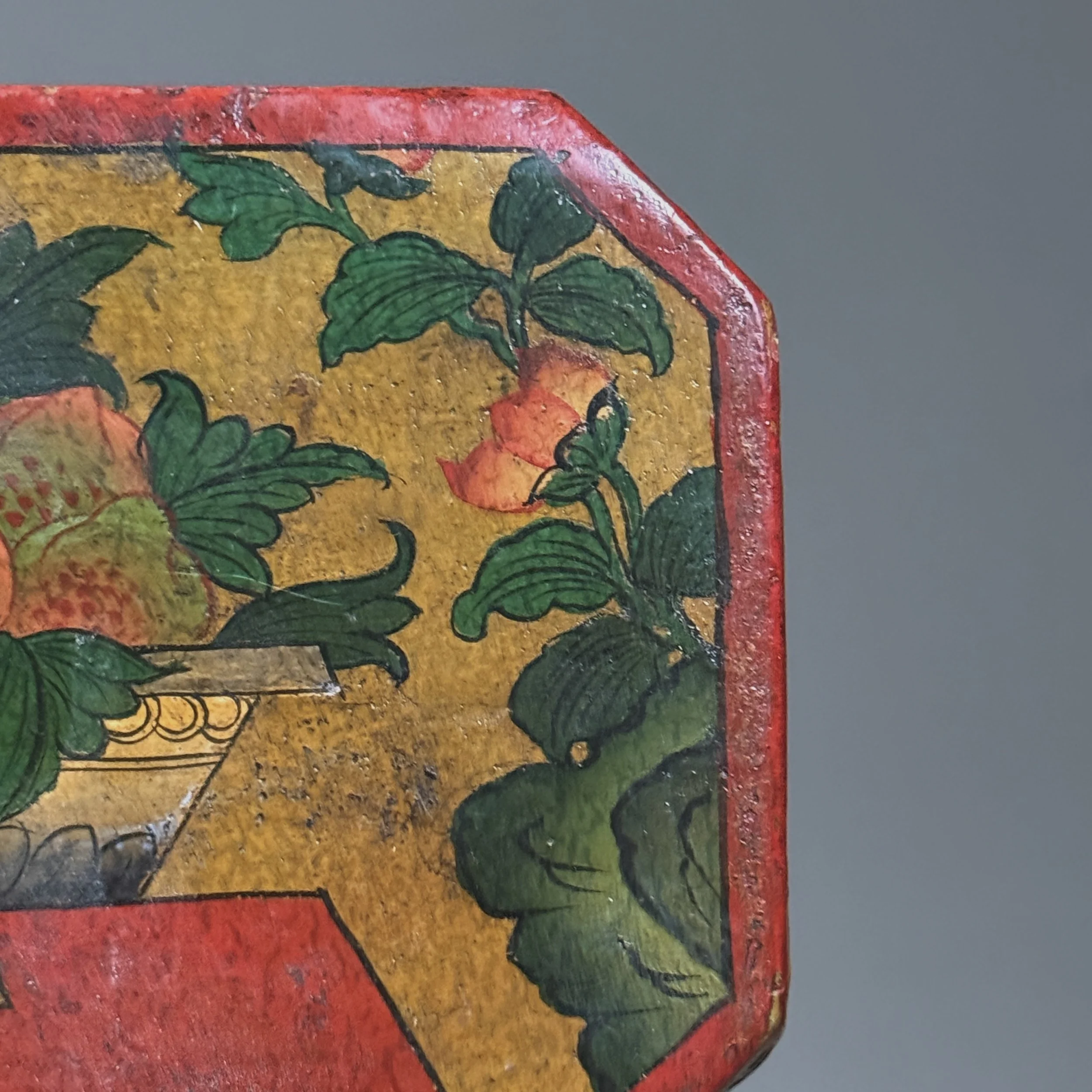 Close-up of exterior decoration. Fruit and foliage motif. Hand painted brushwork.