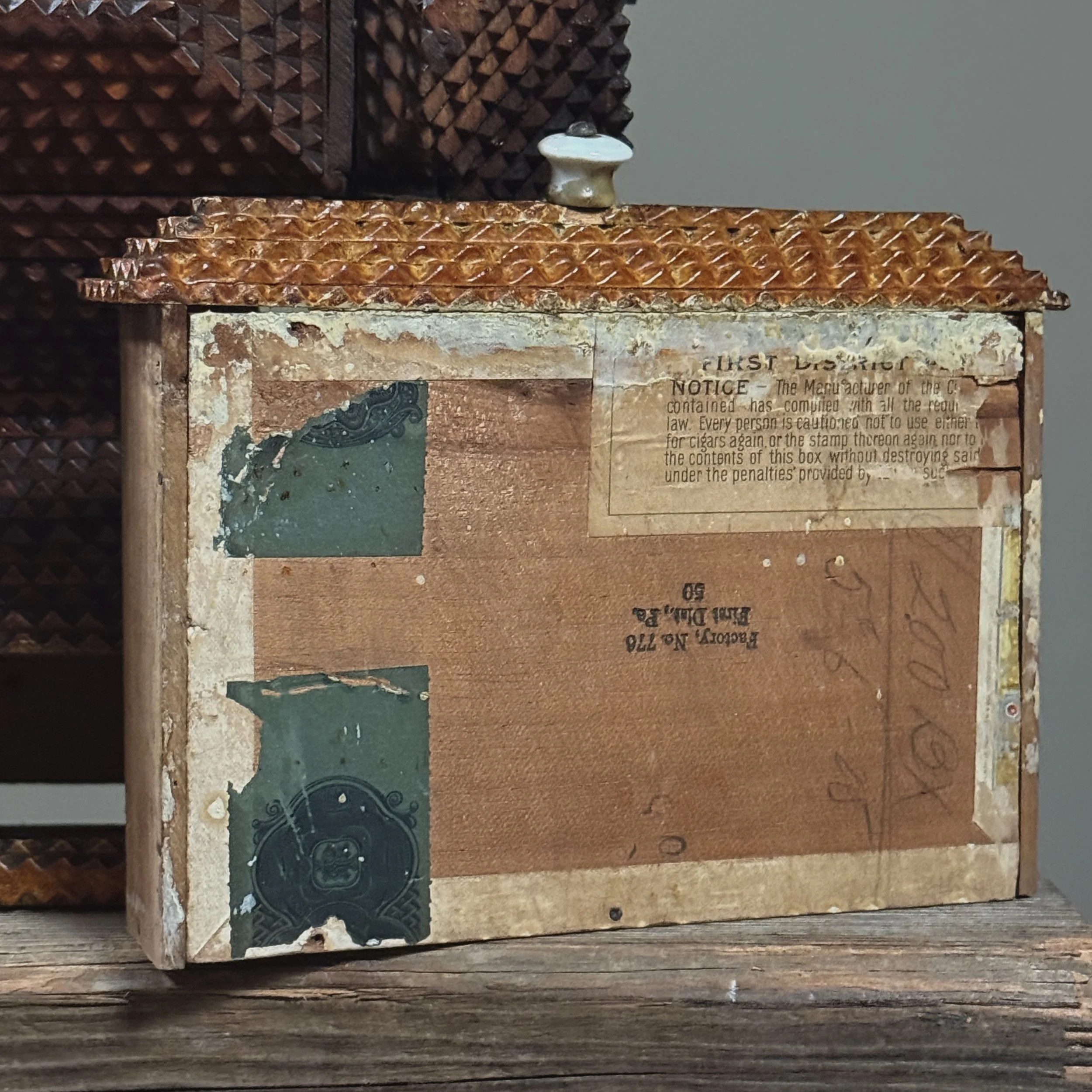 Close-up of cigar label lining on underside of antique drawer