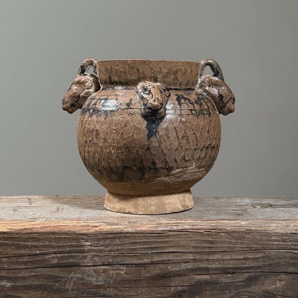 Full frontal view of the Han Dynasty-style globular jar with ram-head handles.