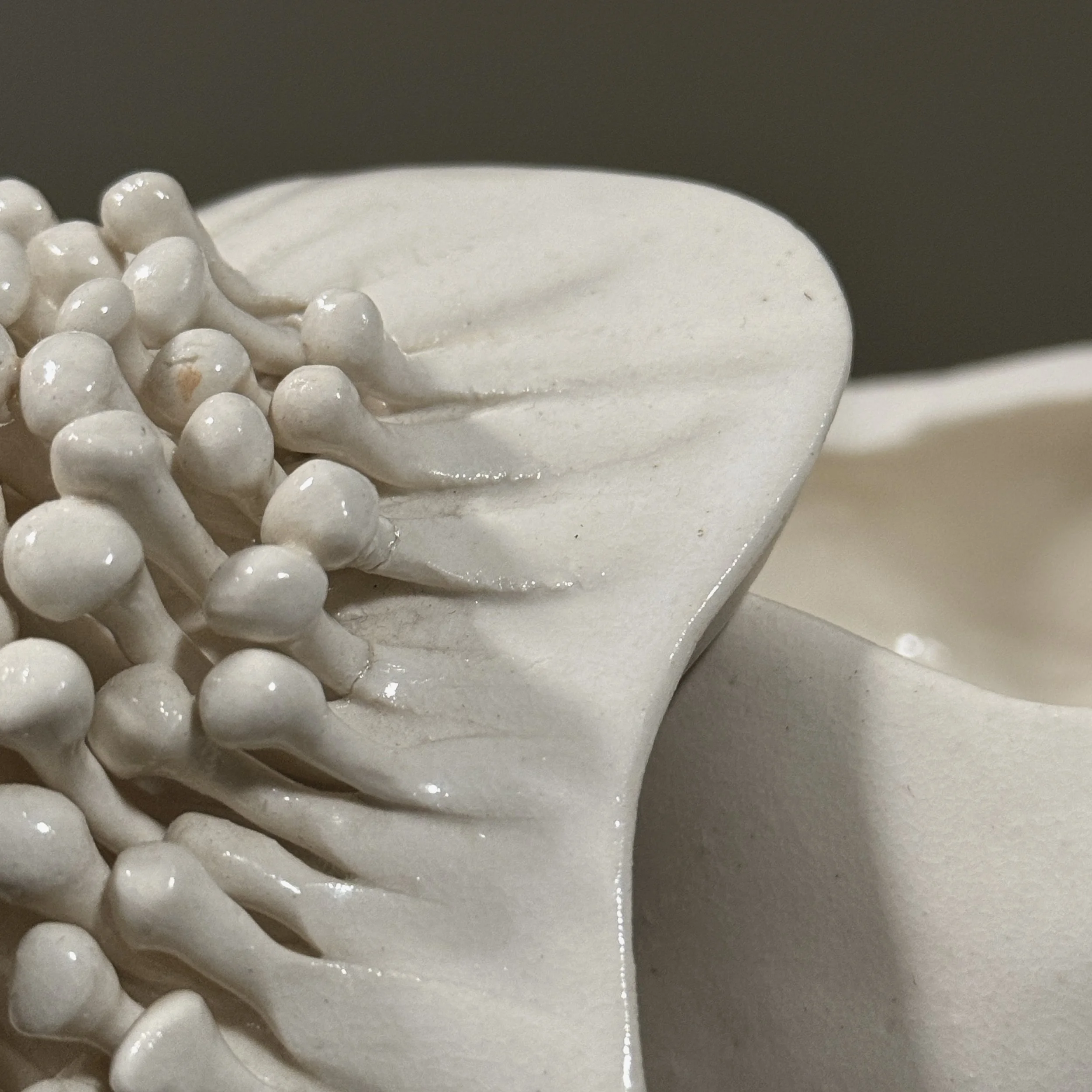 Sculptural ceramic vessel showing repairs and condition details