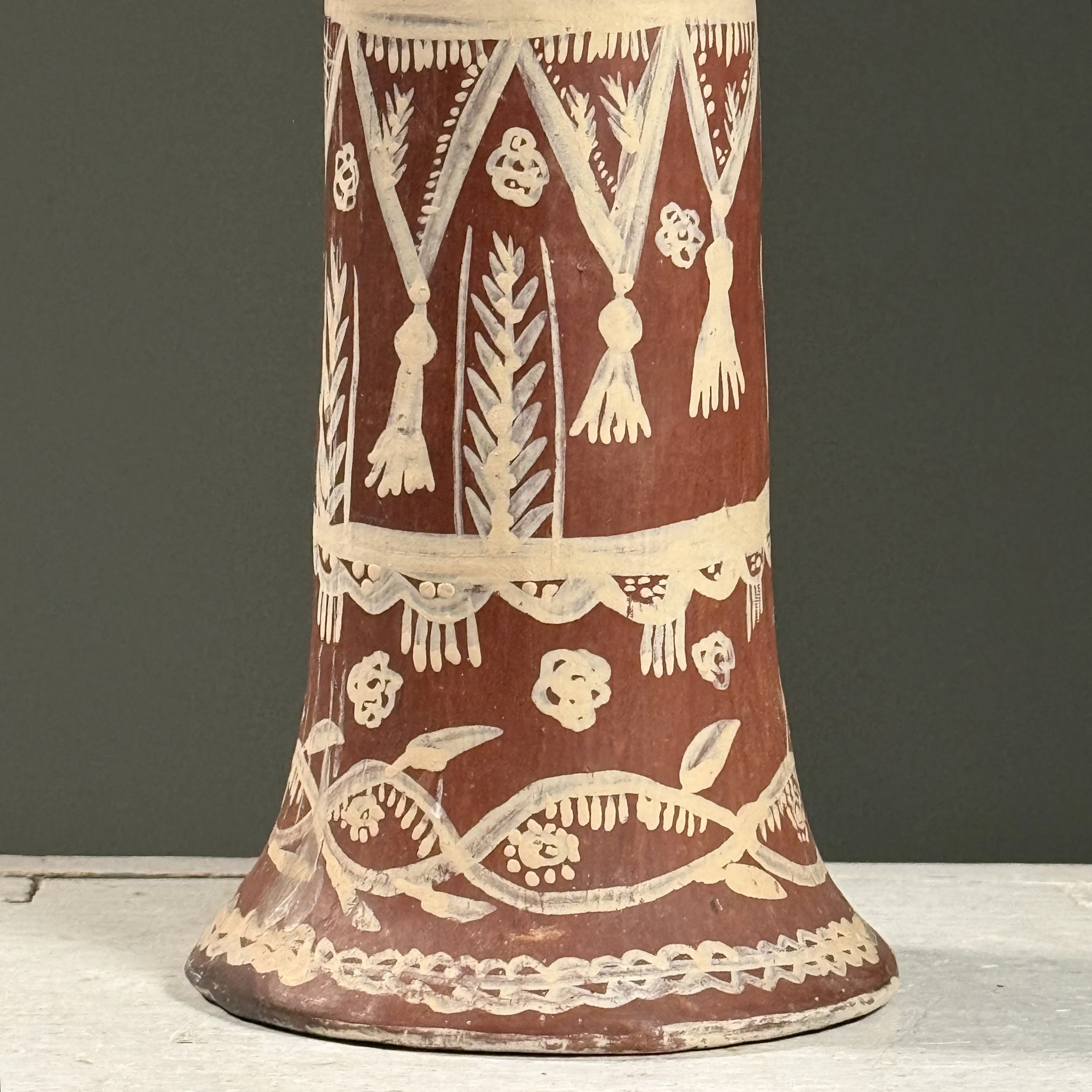 Macro detail of hand-painted polychrome decoration and ceramic construction techniques