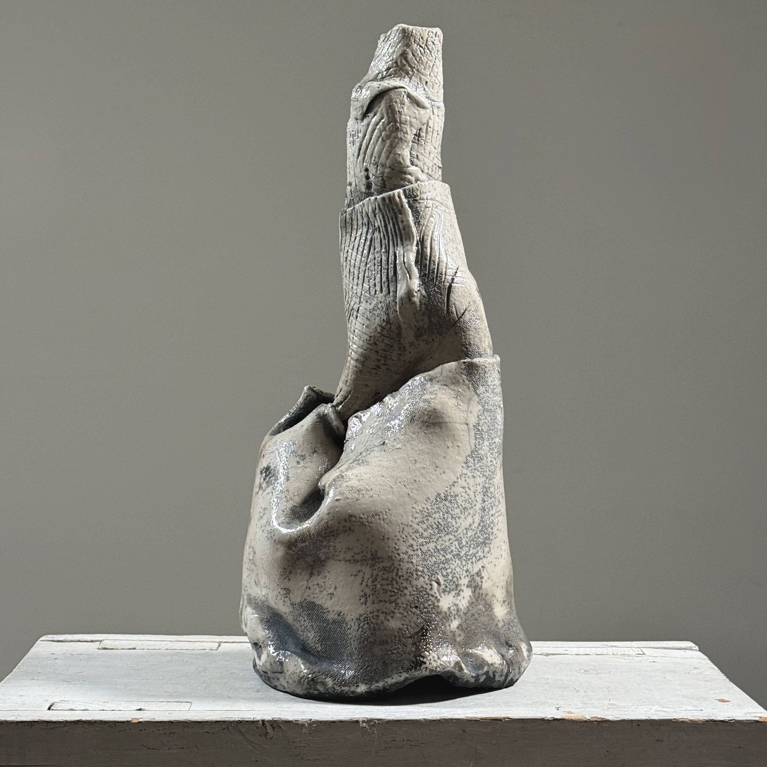 Postmodern abstract raku fired white glazed ceramic vessel