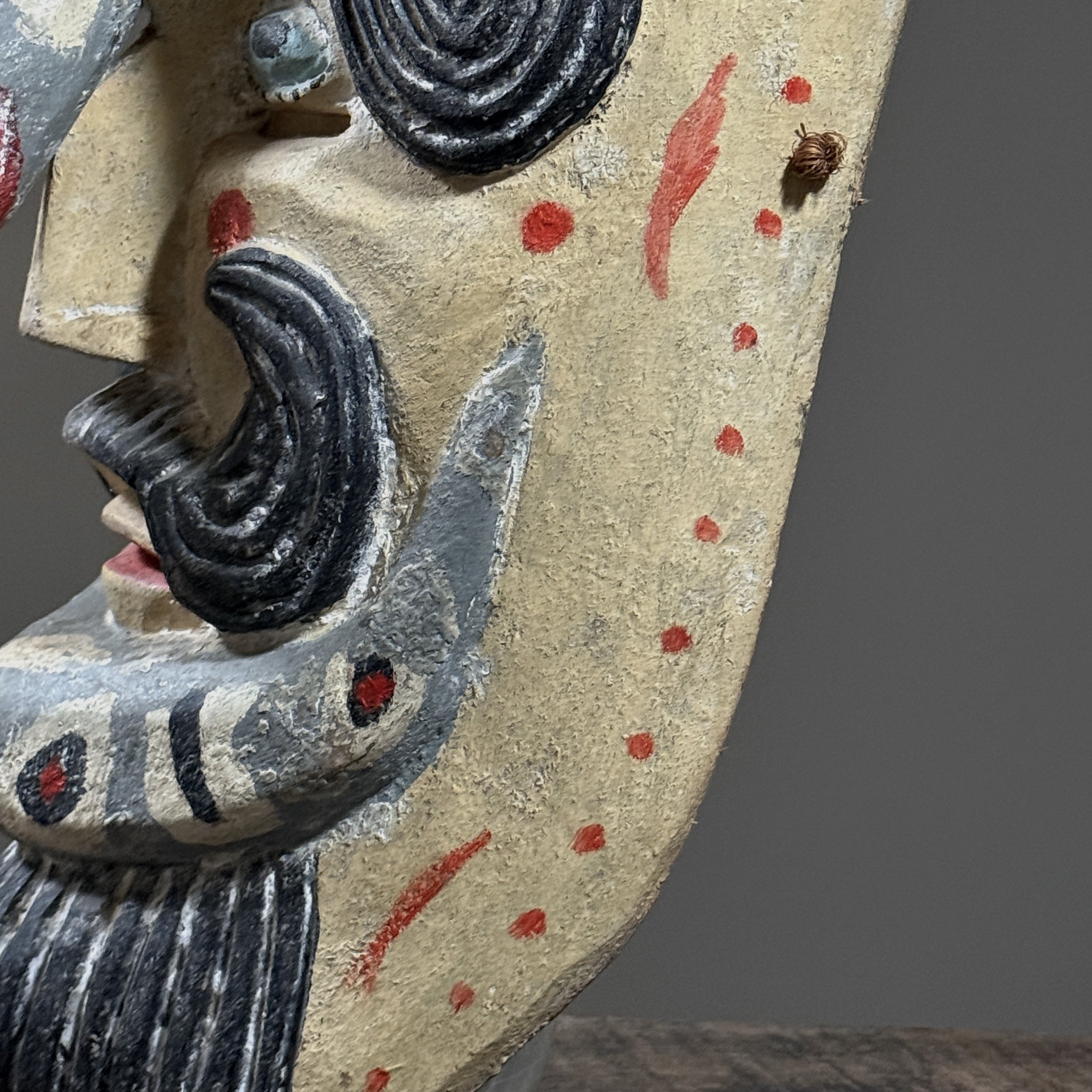 Detail of the eye and cheek area showing paint application.