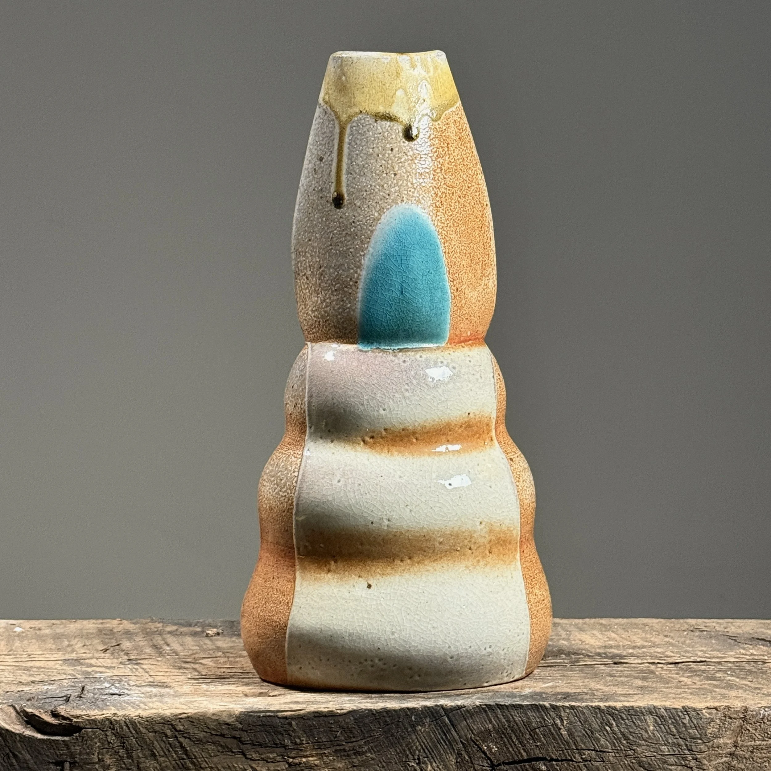 Front view of a vintage postmodernist biomorphic vase with graduating bulges.