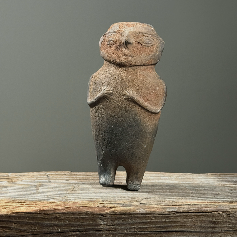 Pre-Columbian style figurative wood fired clay rattle. 7 inches height by 3.5 inches width by 2 inches depth.