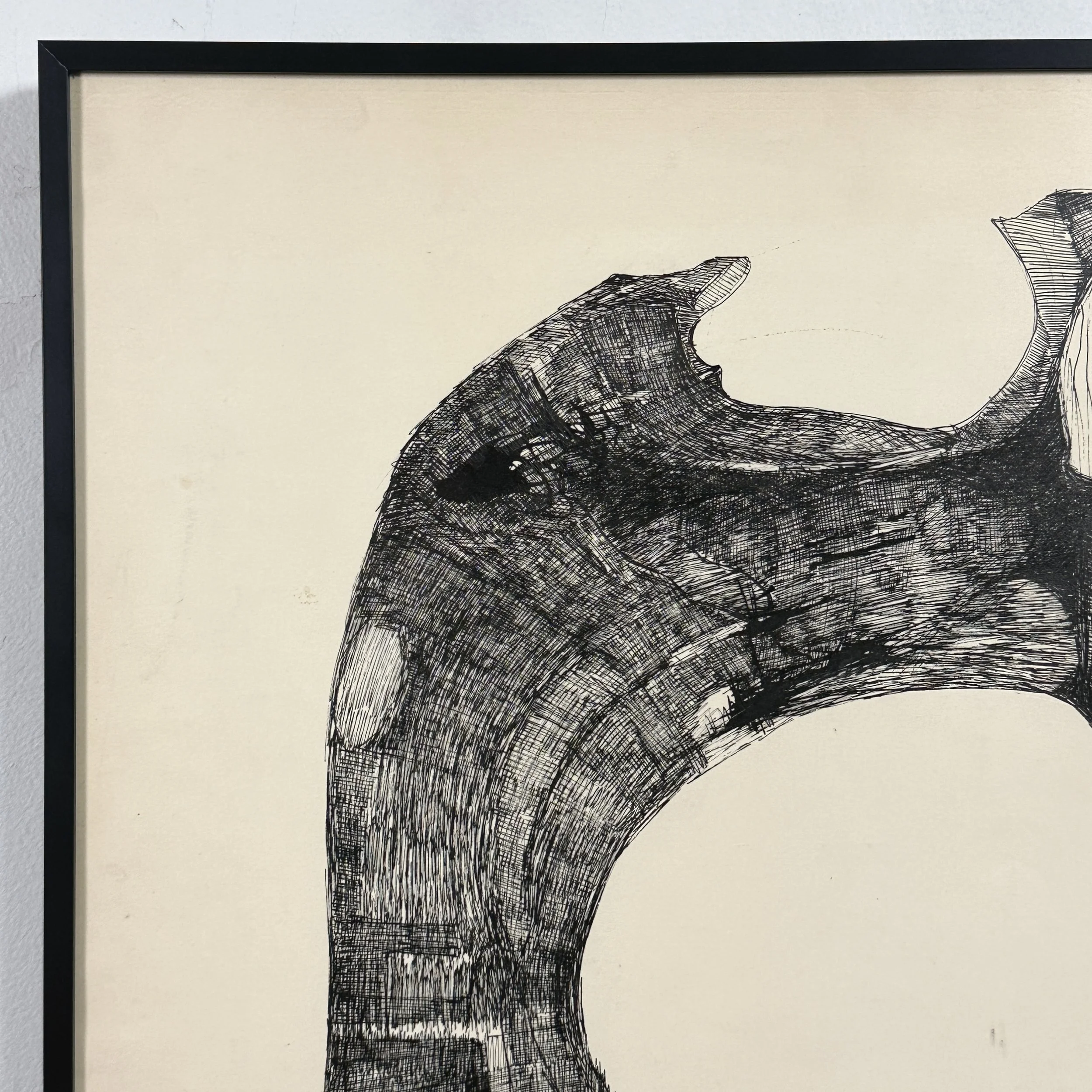 View of the artwork's cream-colored paper and black ink through the non-glare glazing.