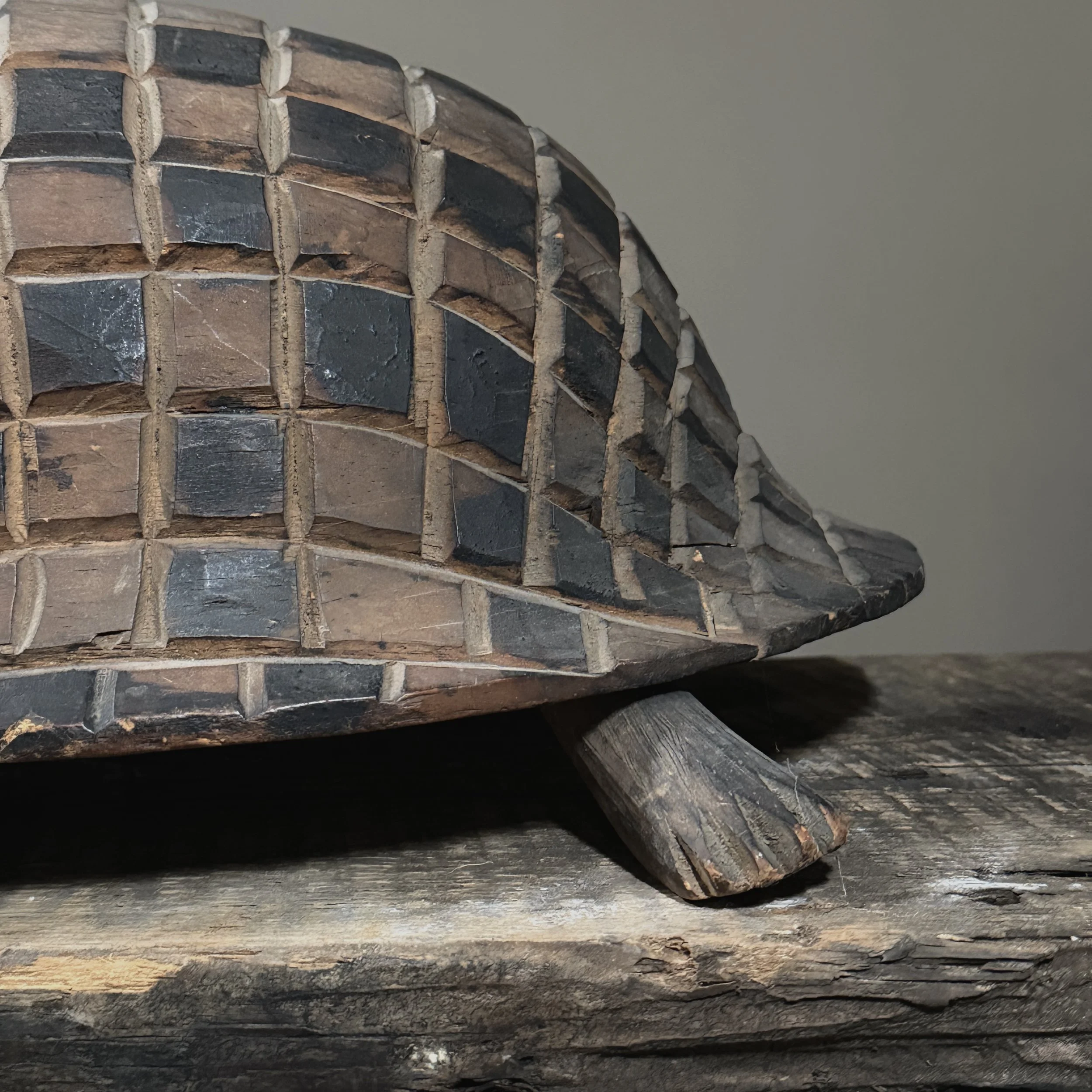 Polychrome folk art turtle sculpture close-up