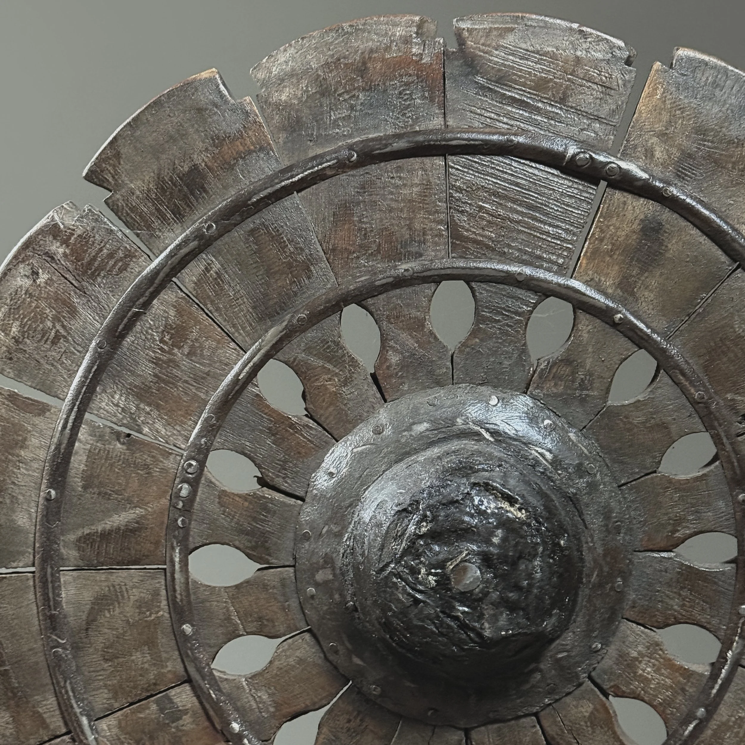 Wheel close-up. Spokes and rim. Hand turned wood.