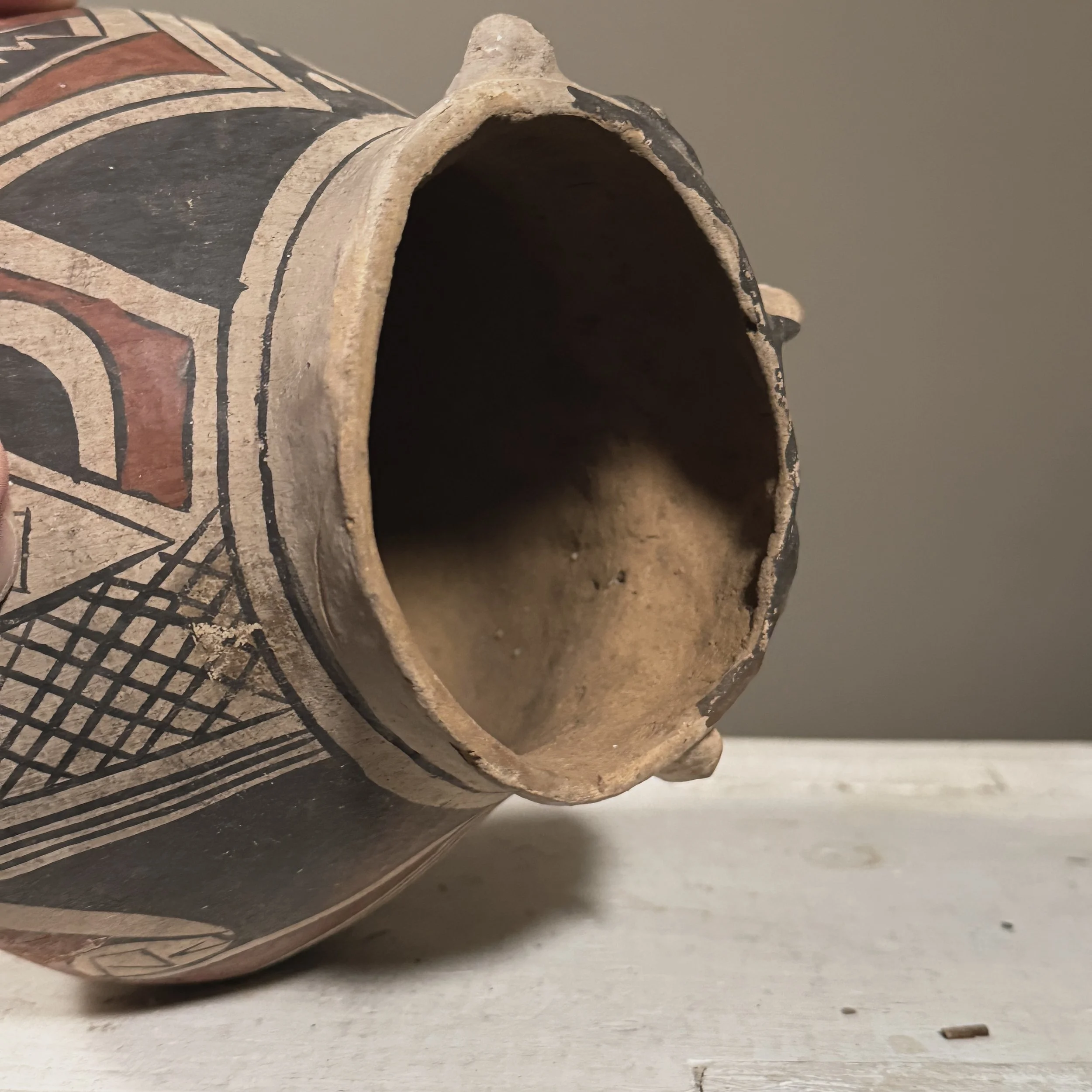 Painted geometric patterns on effigy vessel