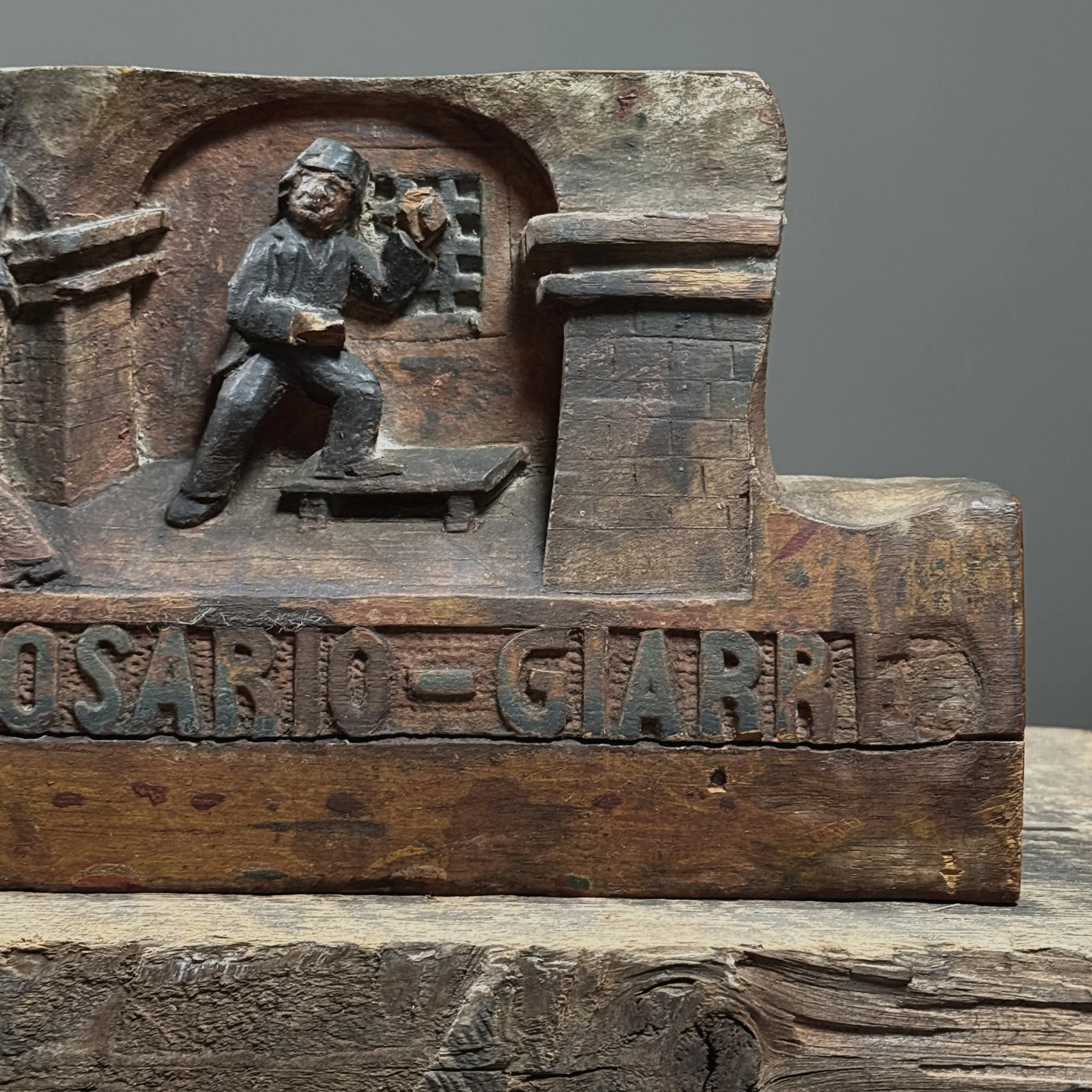 Detail of sword fight. Four male figures. Carved narrative composition.