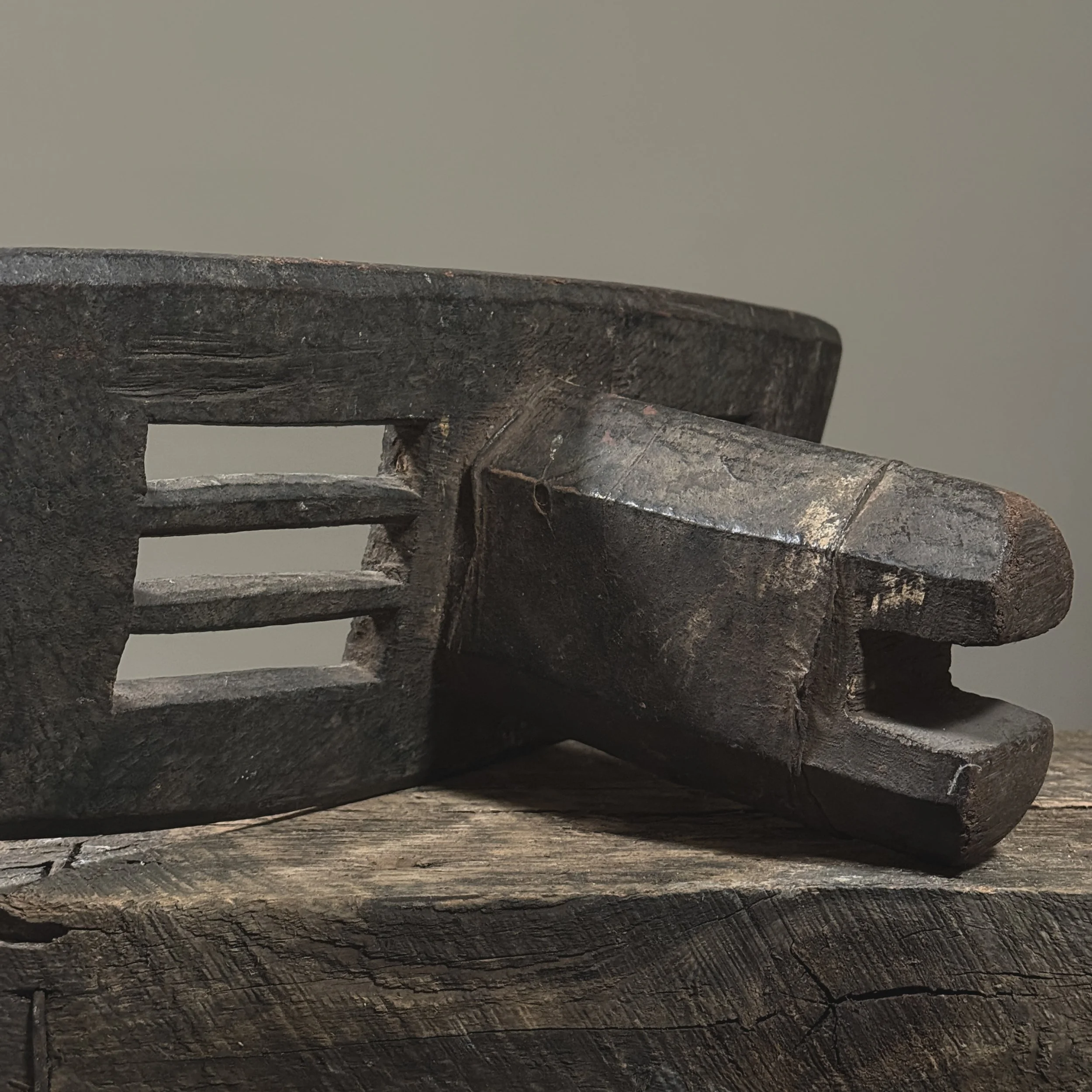 Hand-carved African backrest with wear