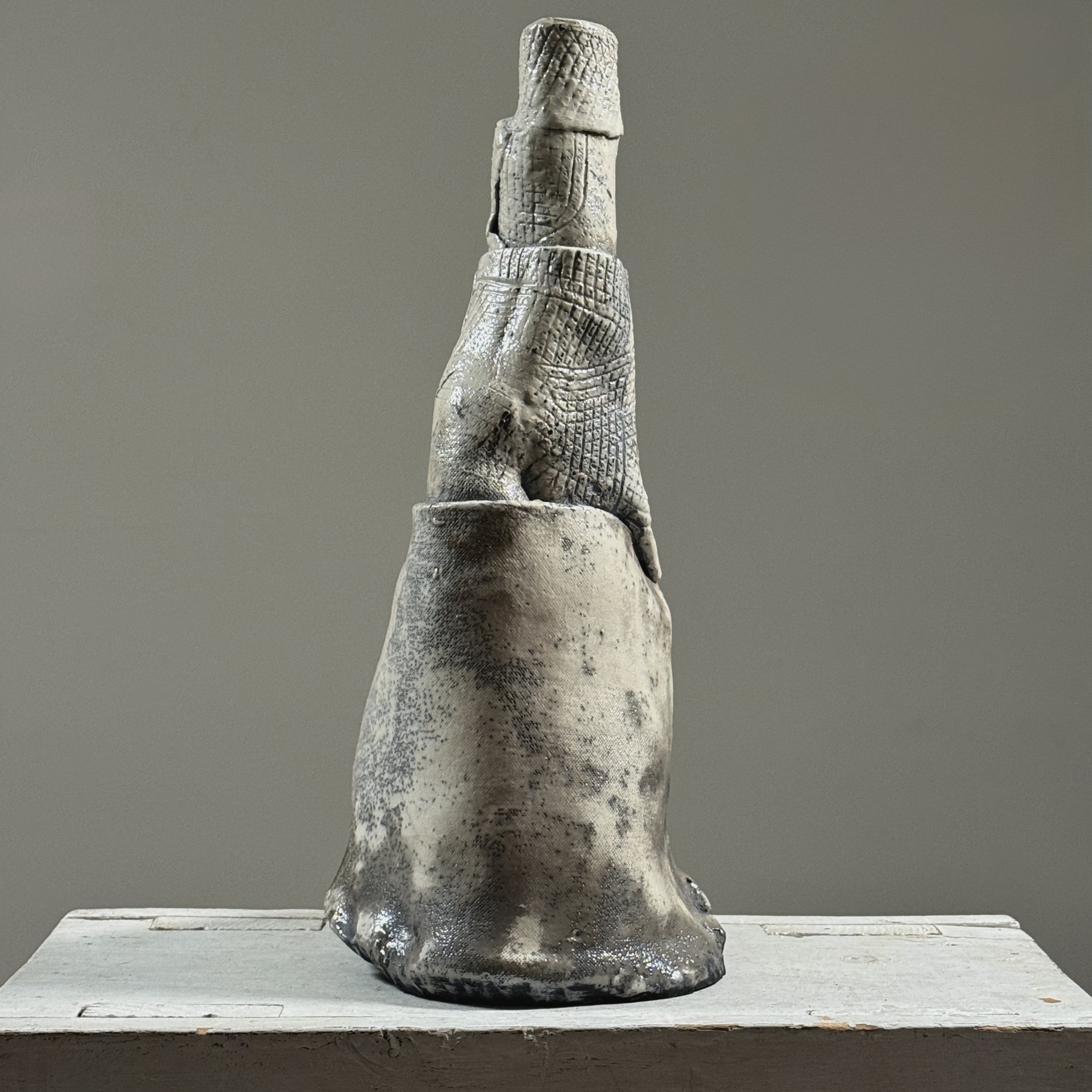 Postmodern abstract raku fired white glazed ceramic vessel